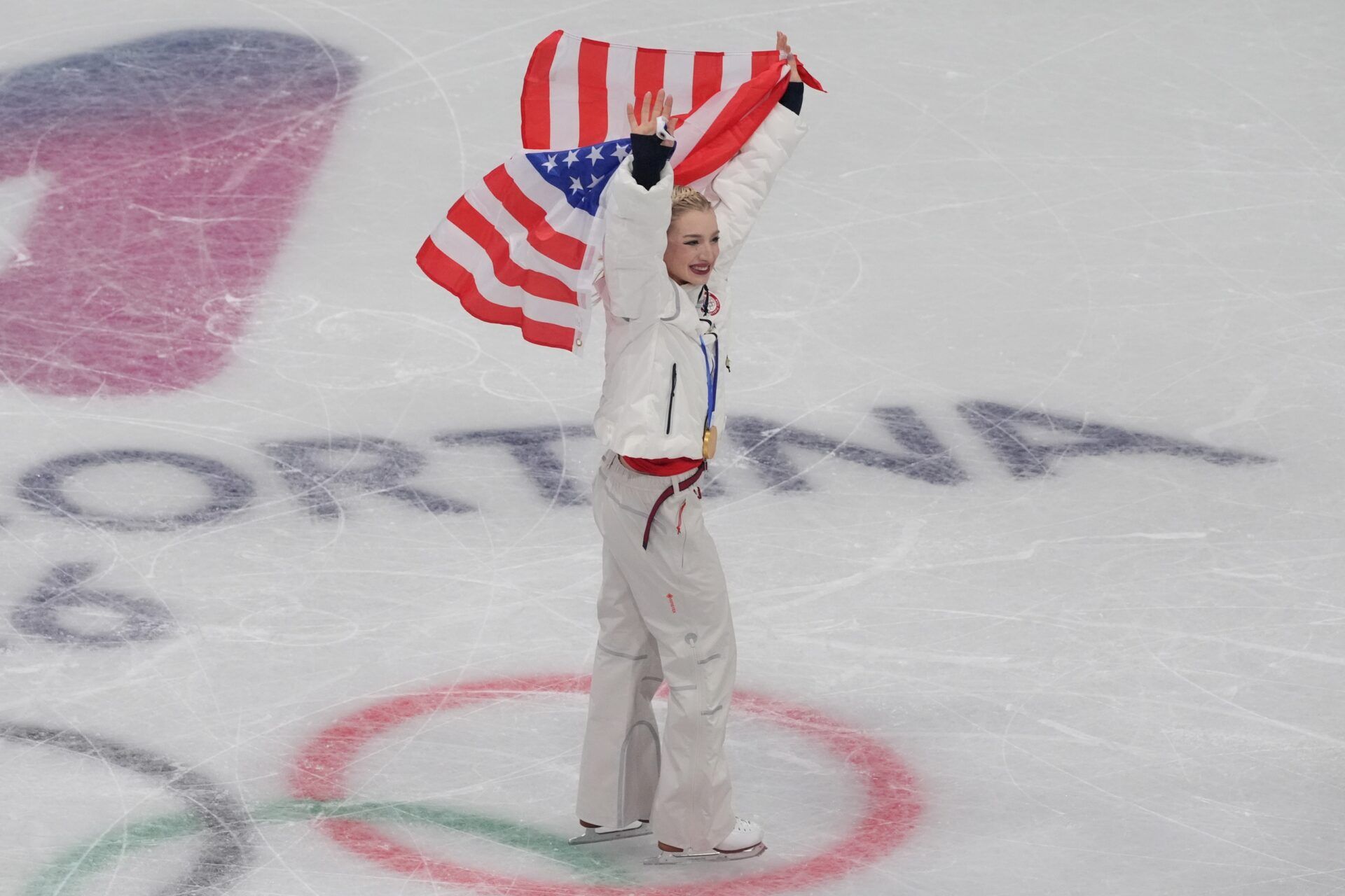 Amber Glenn of the United States of America celebrates after winning gold in the figure skating team event during the Milano Cortina 2026 Olympic Winter Games at Milano Ice Skating Arena.