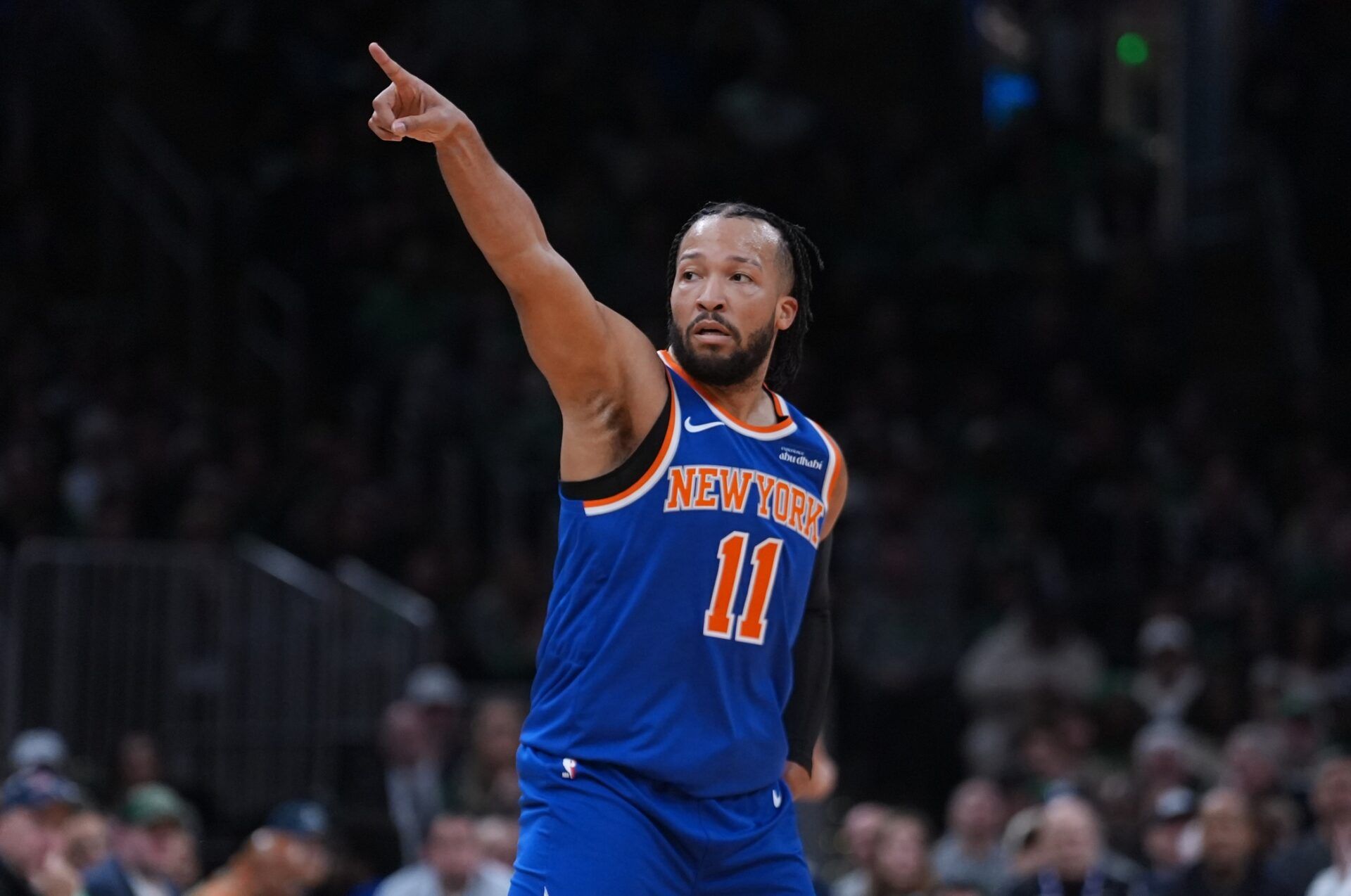 New York Knicks guard Jalen Brunson (11) reacts after his three point basket against the Boston Celtics in the first quarter at TD Garden.