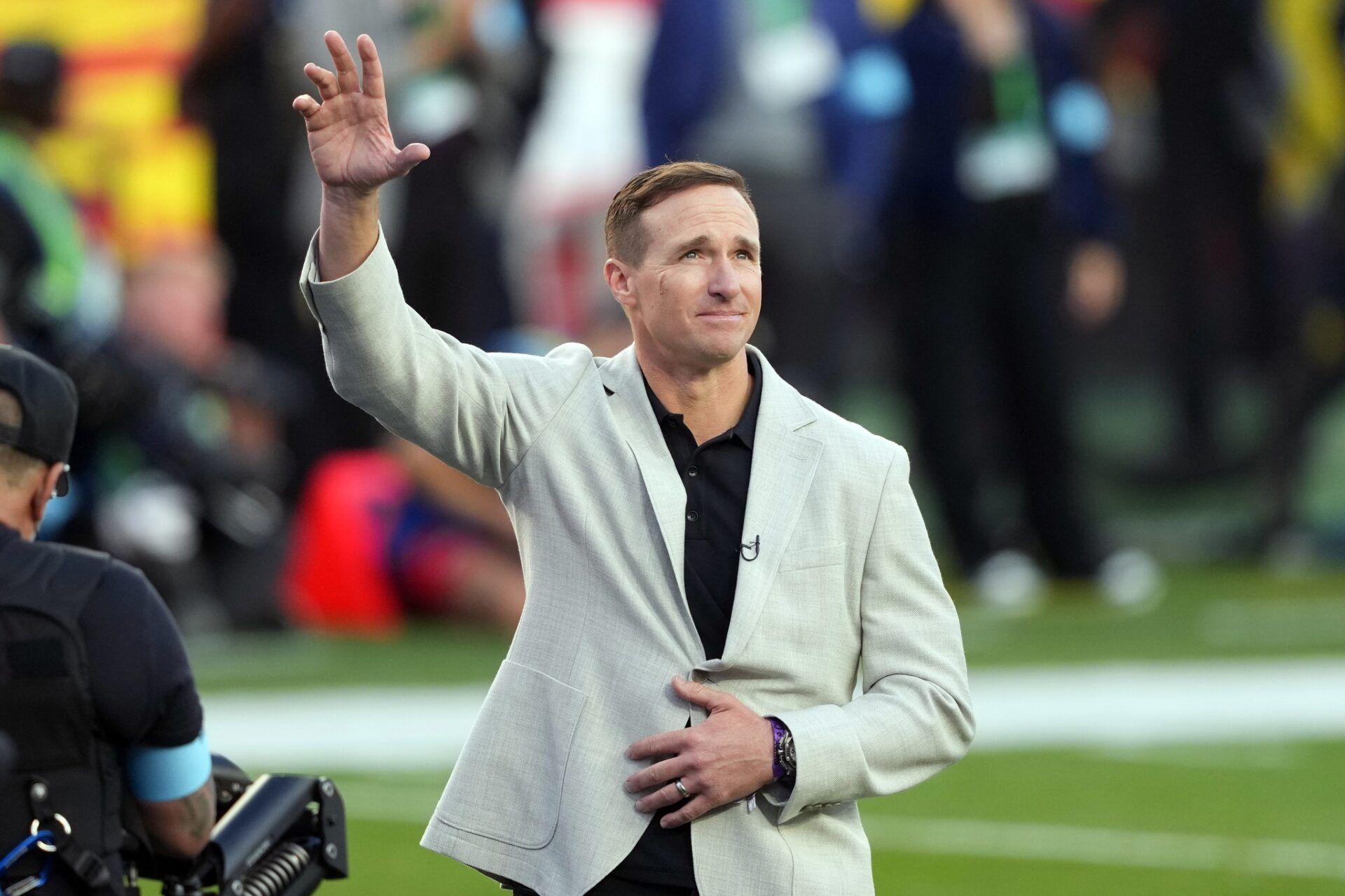 New Orleans Saints former player Drew Brees stands on the field before the start of the second quarter in Super Bowl LX between the New England Patriots and the Seattle Seahawks at Levi's Stadium.