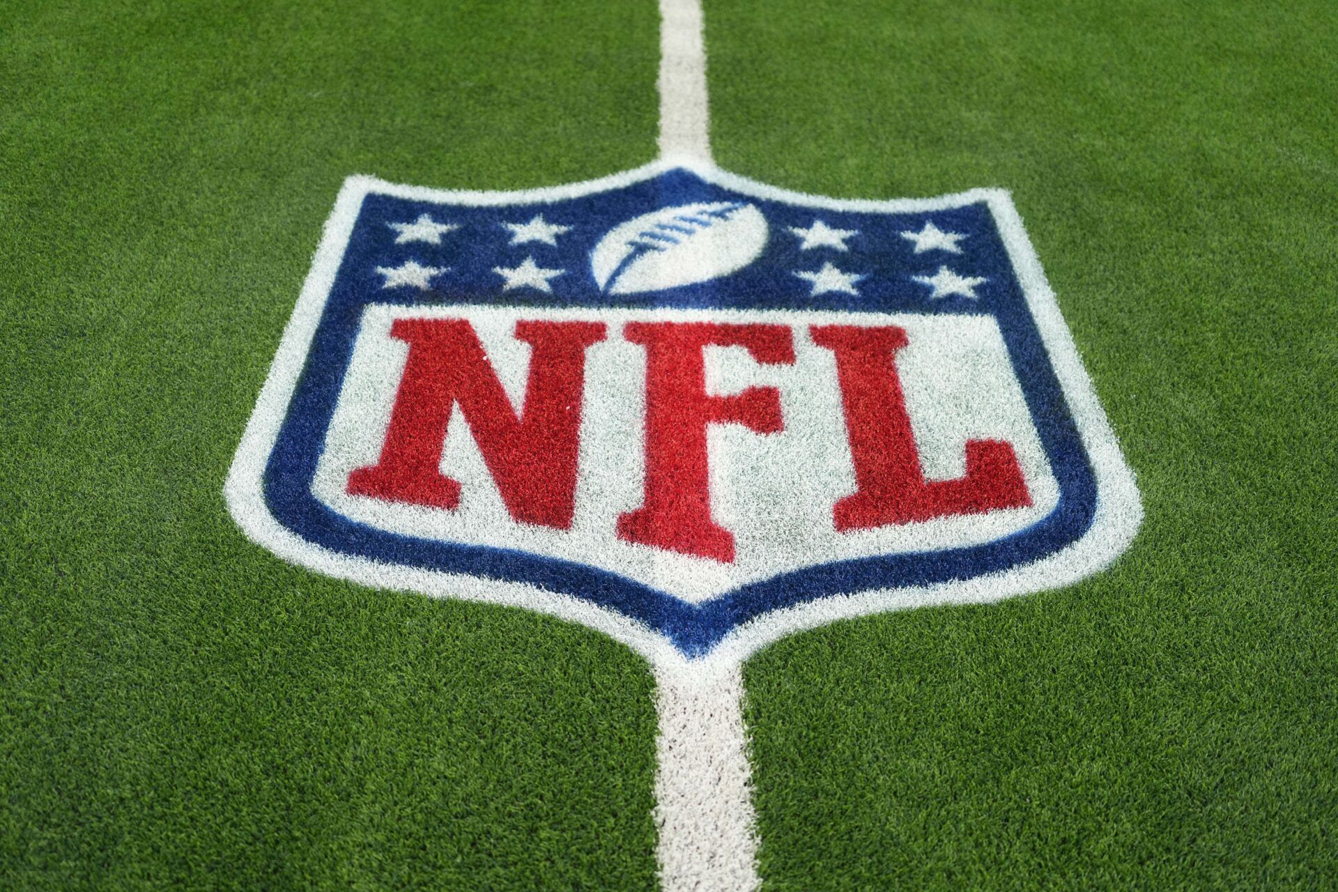 The NFL shield logo is seen on the field at SoFi Stadium before a game between the Arizona Cardinals and Los Angeles Rams.