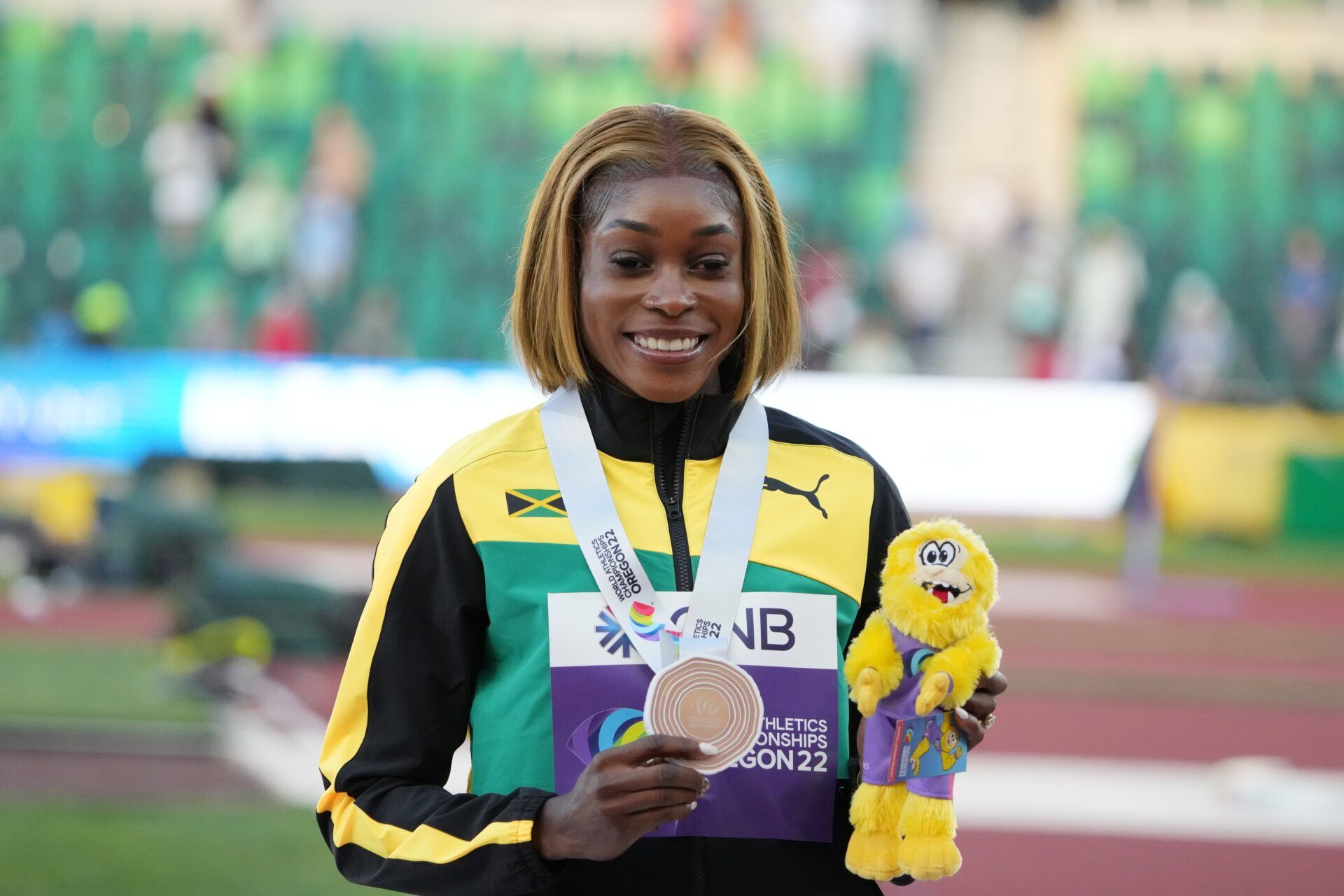 Elaine Thompson-Herah (JAM) poses with her bronze medal in the women’s 100m during the World Athletics Championships Oregon 22 at Hayward Field.