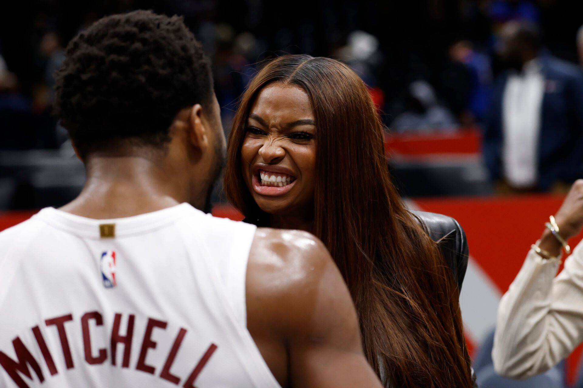 Cleveland Cavaliers guard Donovan Mitchell (45) celebrates with fiancee Coco Jones (R) after the Cavaliers' game against the Washington Wizards at Capital One Arena.