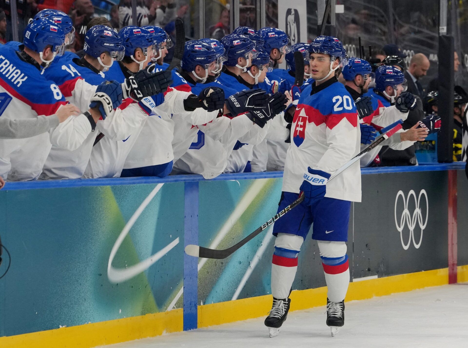 Juraj Slafkovsky of Slovakia celebrates scoring their first goal with teammates during a Group B men's ice hockey game during the Milano Cortina 2026 Olympic Winter Games at Milano Santagiulia Ice Hockey Arena.