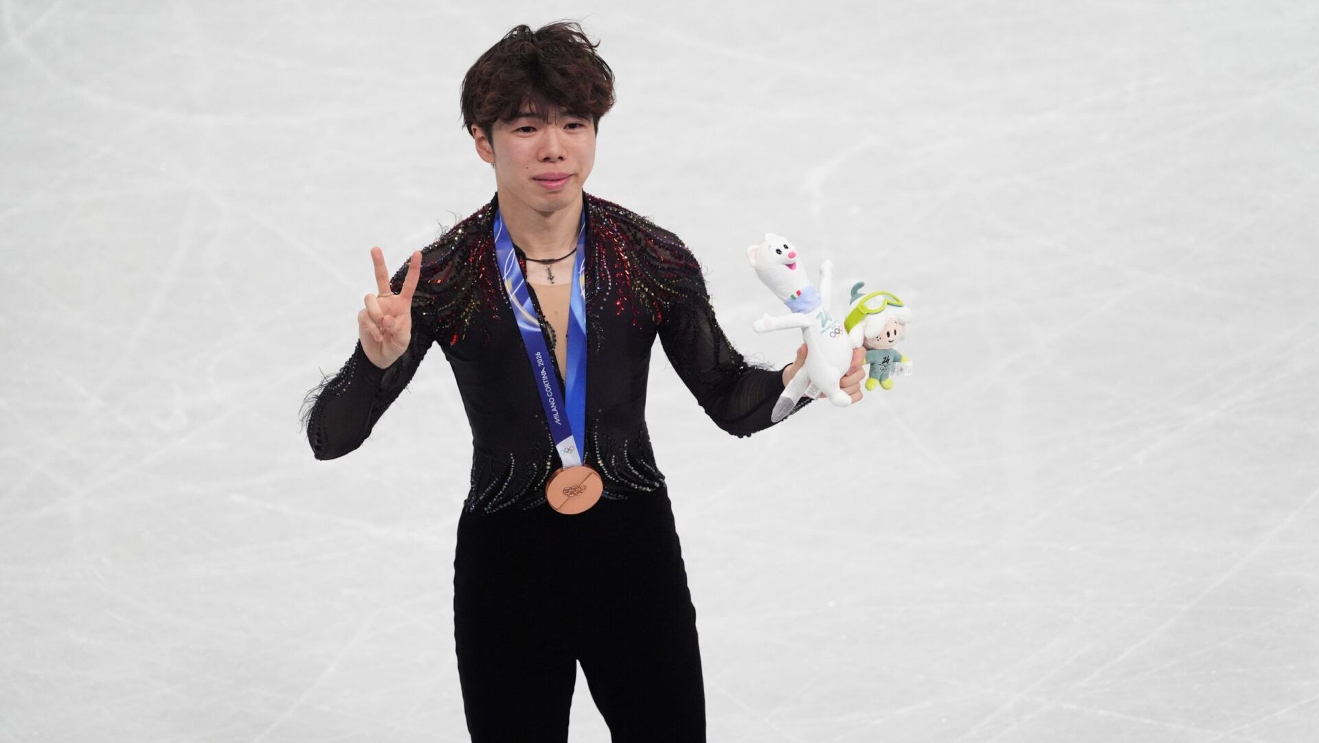 Shun Sato of Japan reacts after winning bronze in the men’s singles free program during the Milano Cortina 2026 Olympic Winter Games at Milano Ice Skating Arena.