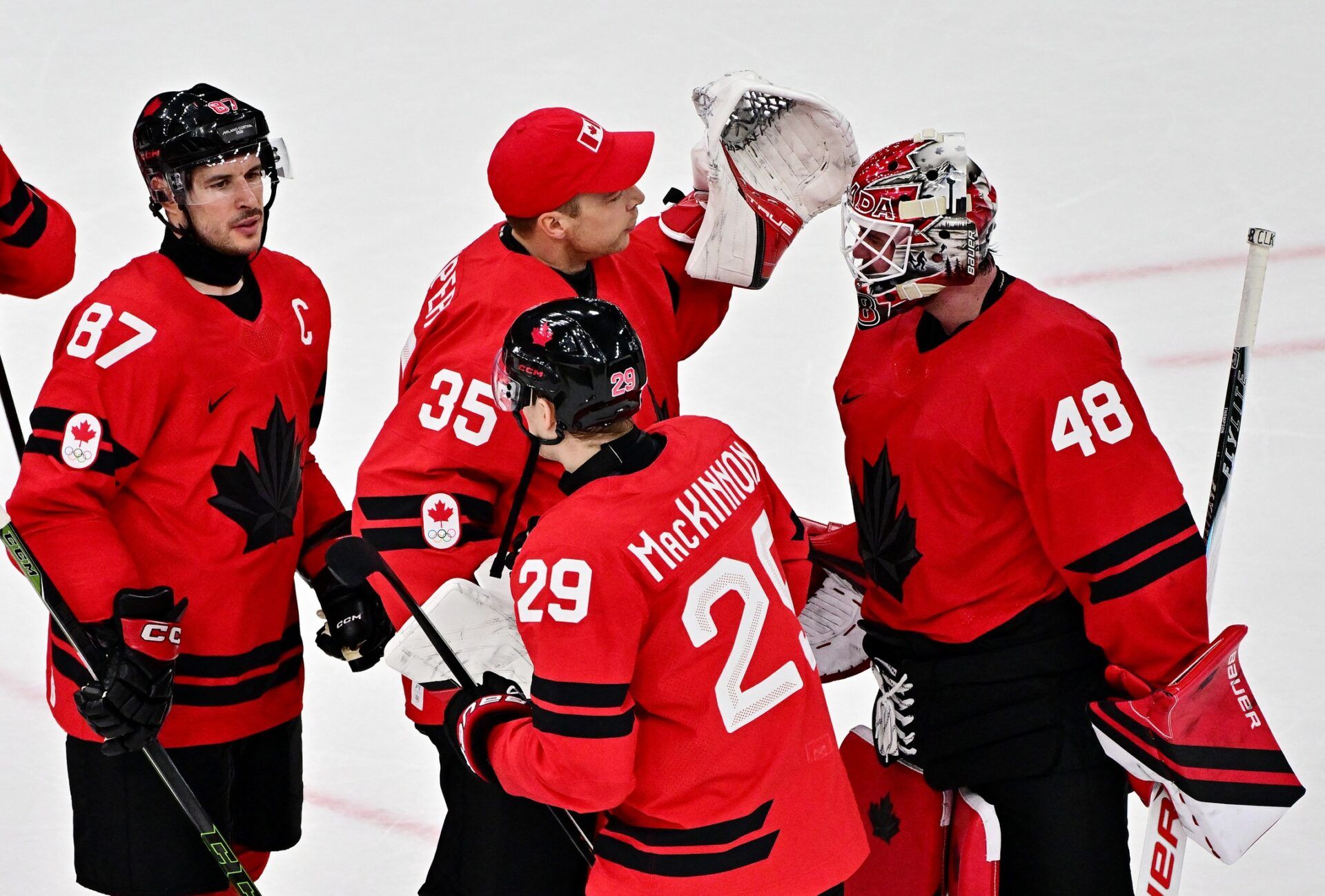 [US, Mexico & Canada customers only] Feb 13, 2026; Milan, Italy; Nathan MacKinnon, Sidney Crosby, Darcy Kuemper and Logan Thompson of Canada celebrate after the match against Switzerland in men's ice hockey group A play during the Milano Cortina 2026 Olympic Winter Games at Milano Santagiulia Ice Hockey Arena.
