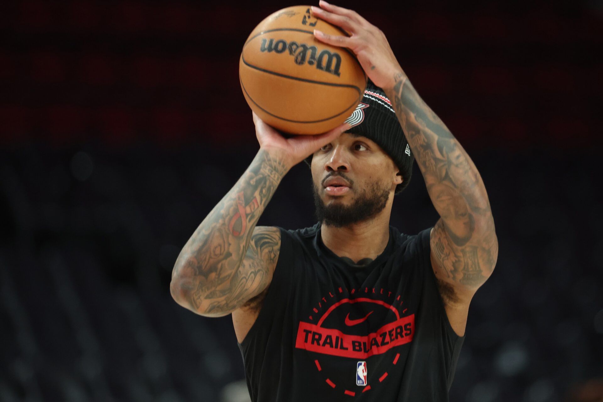 Portland Trail Blazers guard Damian Lillard (0) shoots a three-point shot during warm ups before the Trail Blazers play against the Philadelphia 76ers at Moda Center.
