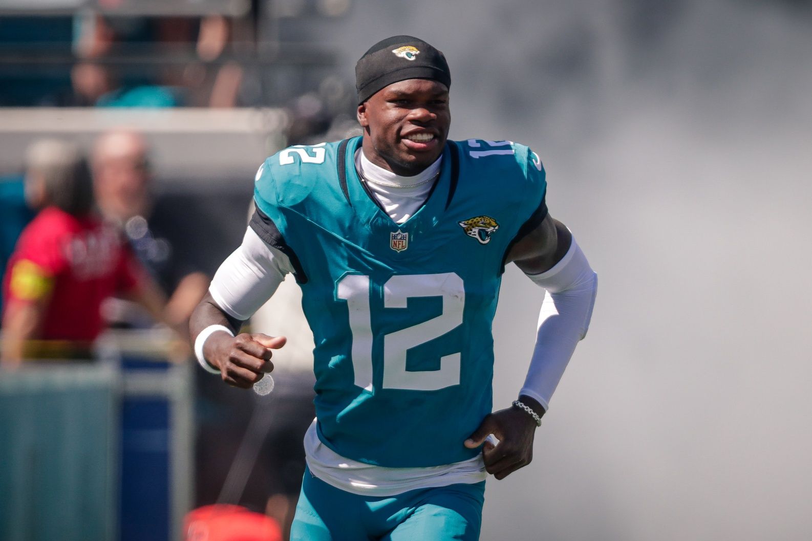 Jacksonville Jaguars player Travis Hunter (12) runs out during team introductions before the game against the Seattle Seahawks at EverBank Stadium.