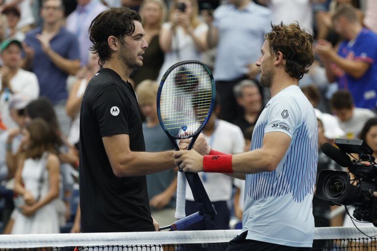 Taylor Fritz (USA)(L) shakes hands with Casper Ruud (NOR)(R) after their men's singles match on day seven of the 2024 U.S. Open tennis tournament at USTA Billie Jean King National Tennis Center.