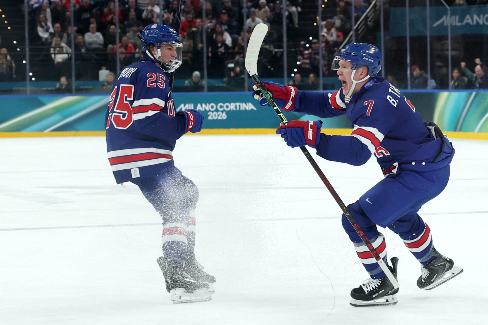 [US, Mexico & Canada customers only] Feb 14, 2026; Milan, Italy; Brady Tkachuk of United States celebrates scoring their second goal with Charlie McAvoy of United States against Denmark in men's ice hockey group C play during the Milano Cortina 2026 Olympic Winter Games at Milano Santagiulia Ice Hockey Arena.