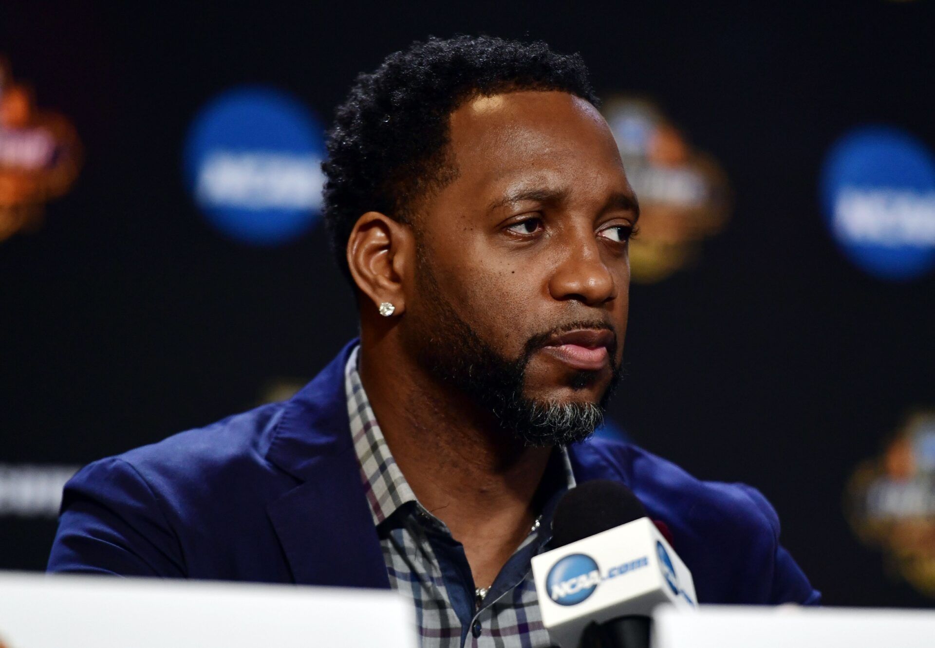 NBA former play Tracy McGrady is interviewed during the Naismith Hall of Game Press Conference at University of Phoenix Stadium.
