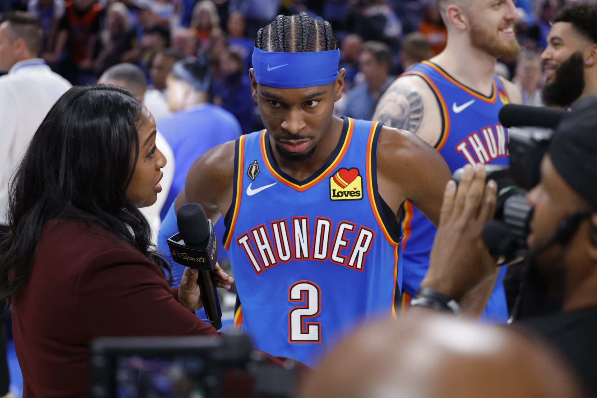 Oklahoma City Thunder guard Shai Gilgeous-Alexander (2) is interviewed by media at the end of a double overtime win against the Houston Rockets at Paycom Center.