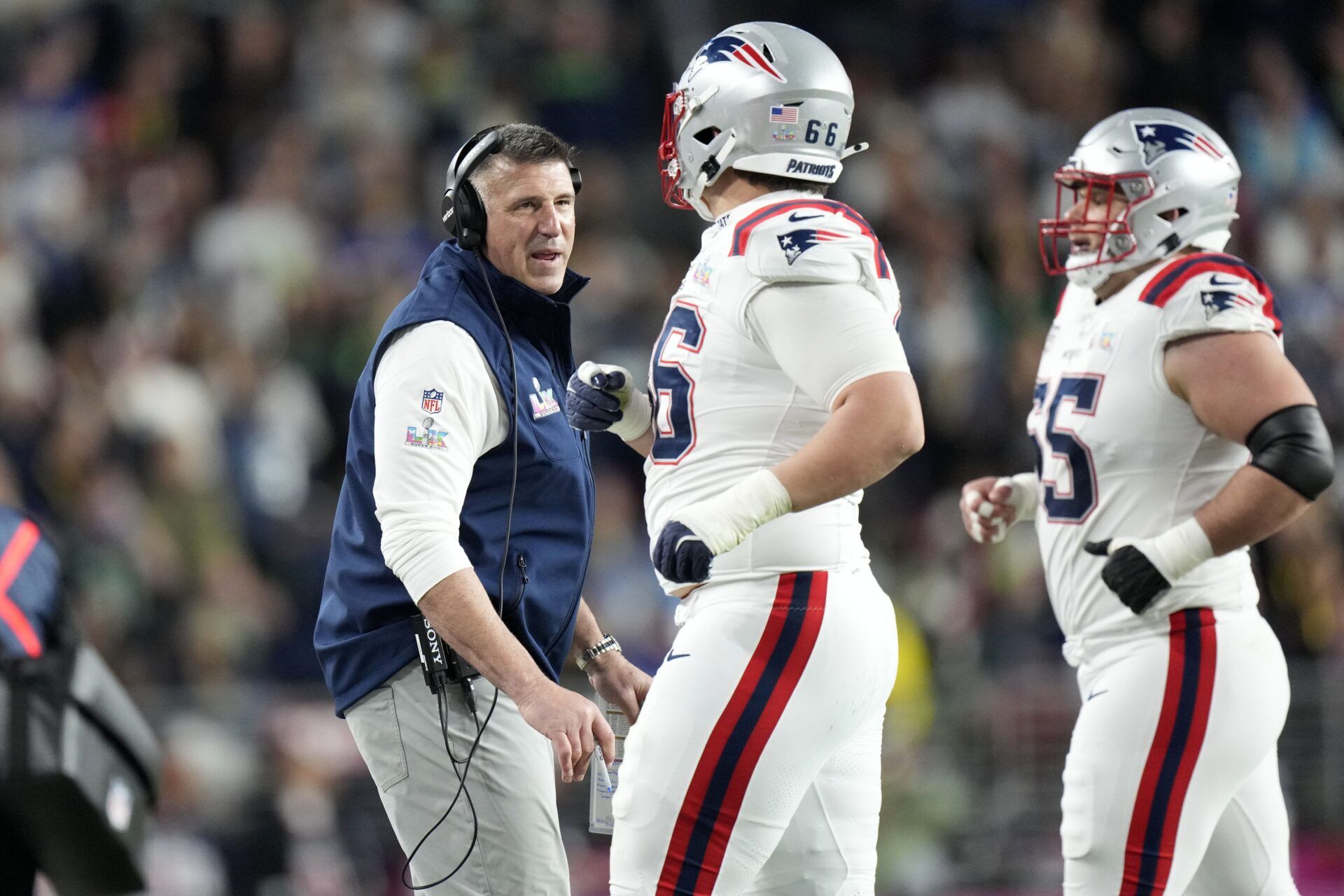 New England Patriots head coach Mike Vrabel talks with offensive tackle Will Campbell (66) during the third quarter against the Seattle Seahawks in Super Bowl LX at Levi's Stadium.