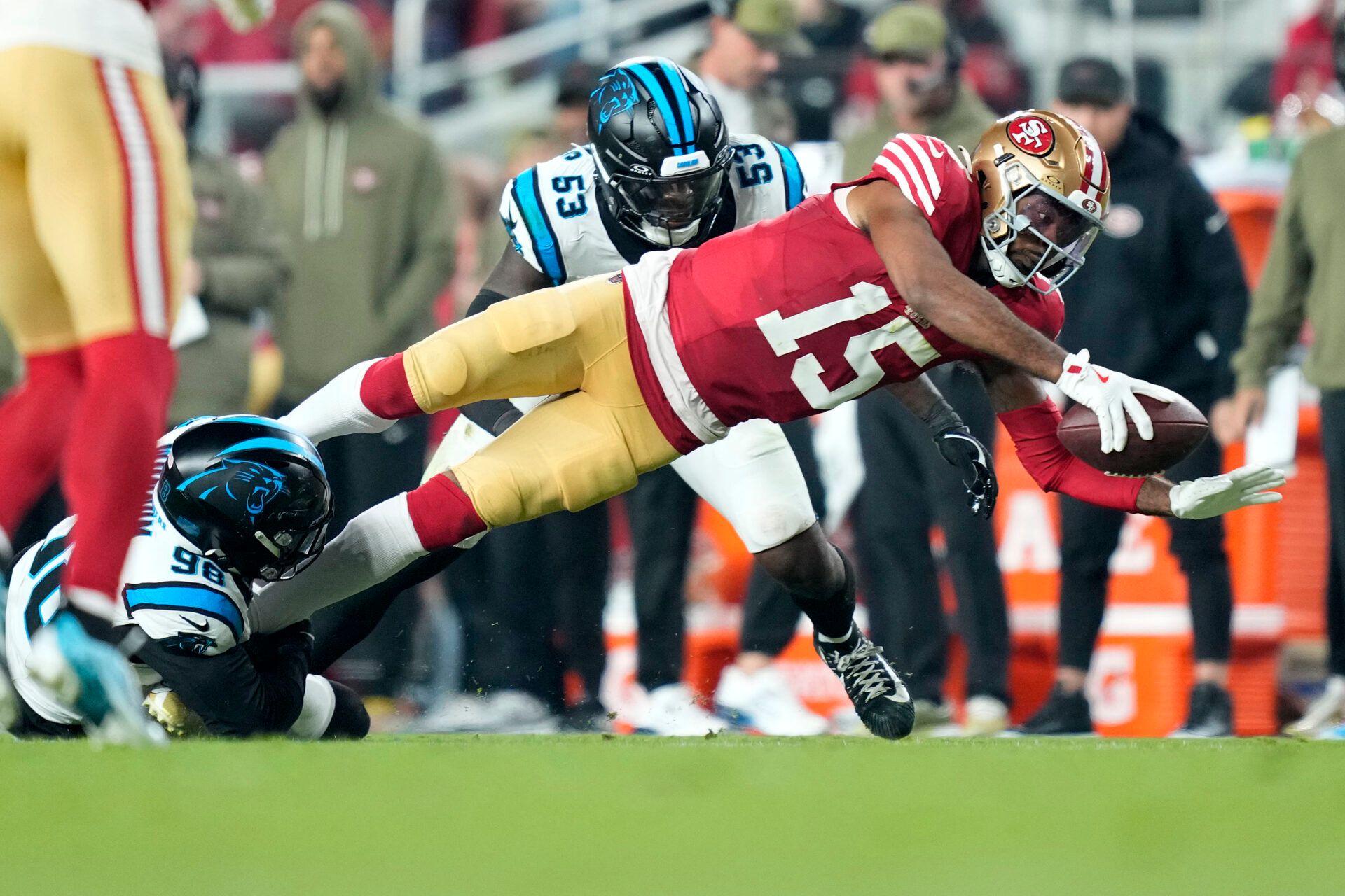 San Francisco 49ers wide receiver Jauan Jennings (15) makes a catch against Carolina Panthers linebacker Claudin Cherelus (53) during the first half at Levi's Stadium.