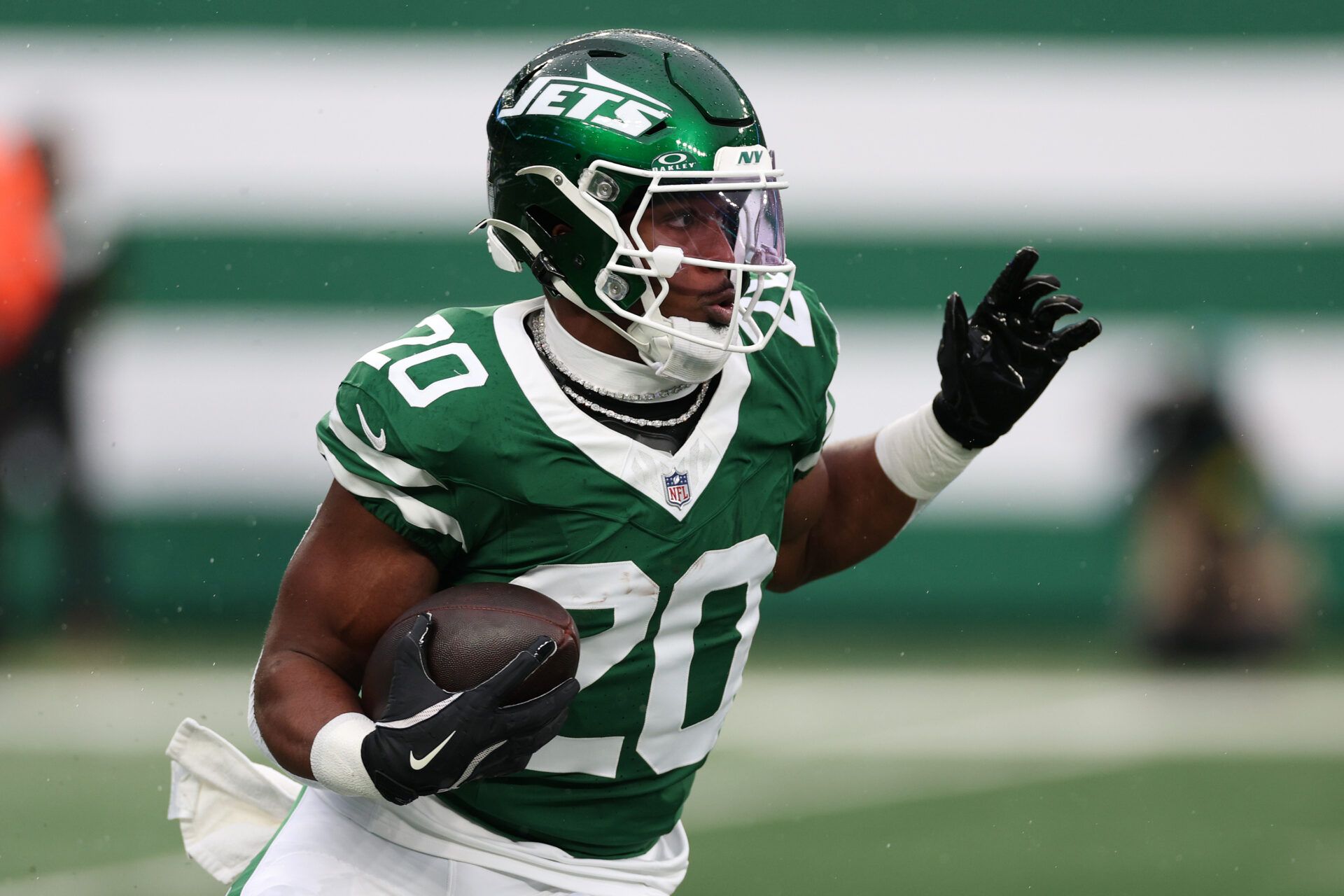 New York Jets running back Breece Hall (20) rushes the ball against the Atlanta Falcons during the first half at MetLife Stadium.
