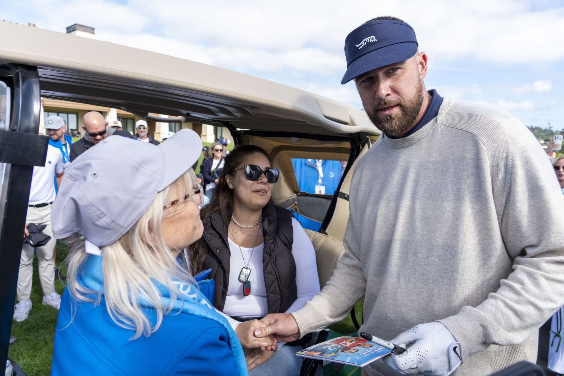 Kansas City Chiefs tight end Travis Kelce (right) autographs a book for Edenne Flinn (left) after being hit by Kelce’s golf ball on the 18th hole during the second round of the AT&T Pebble Beach Pro-Am golf tournament at Pebble Beach Golf Links. 

Credit: Kyle Terada-Imagn Images
