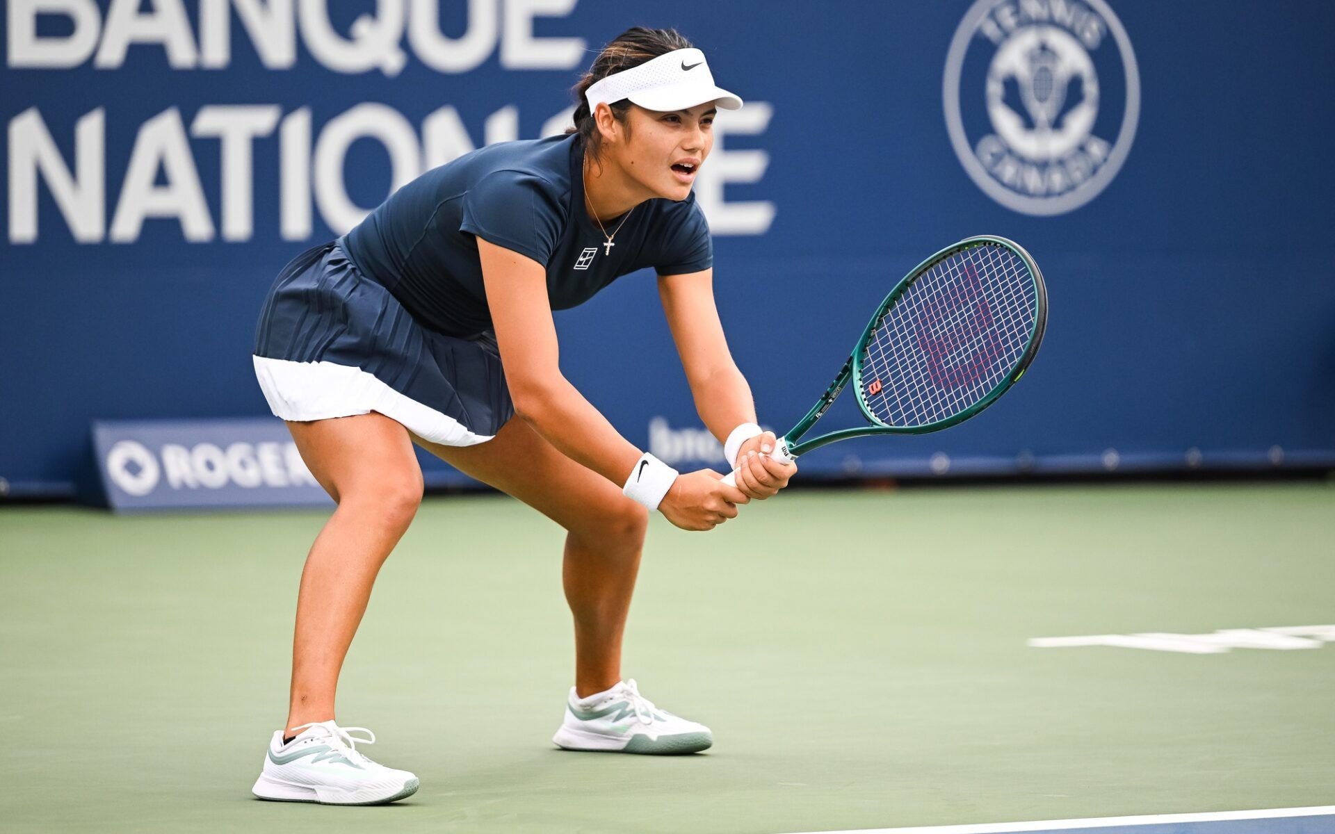 Emma Raducanu (GBR) waits for Peyton Stearns (USA) to serve the ball in second round play at IGA Stadium.