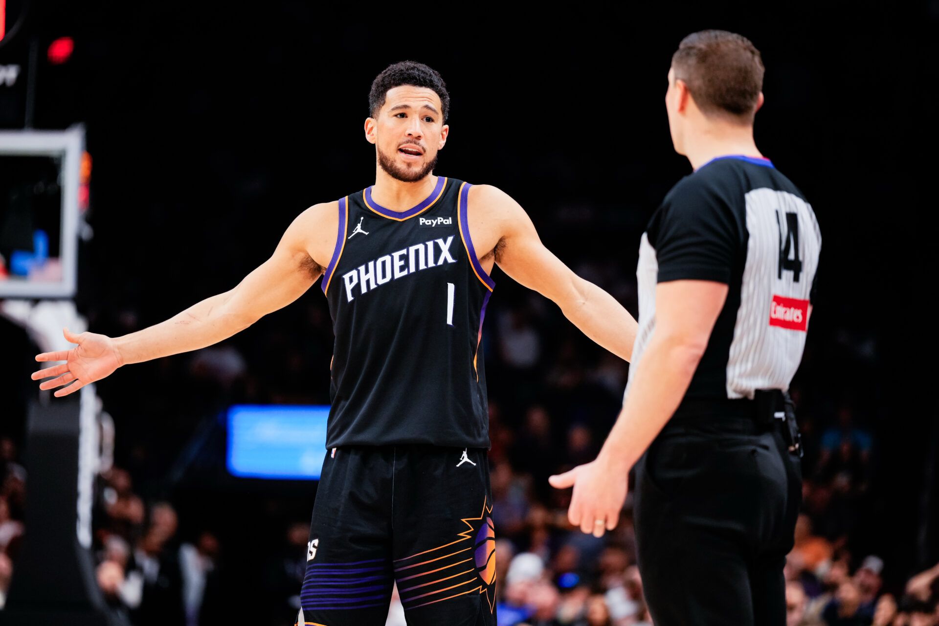 Phoenix Suns guard Devin Booker (1) questions a ref in the second half of the game against the Dallas Mavericks at Mortgage Matchup Center.