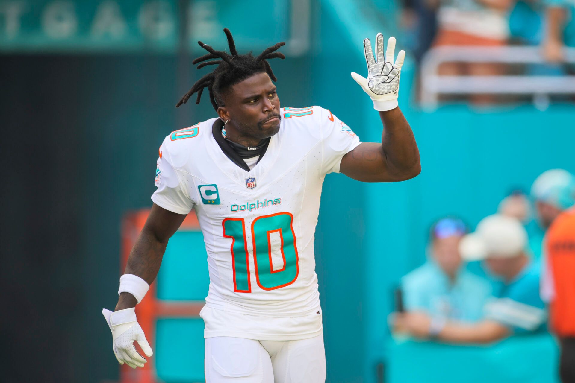 Miami Dolphins wide receiver Tyreek Hill (10) reacts while taking on the field prior to the game against the Carolina Panthers at Hard Rock Stadium.
