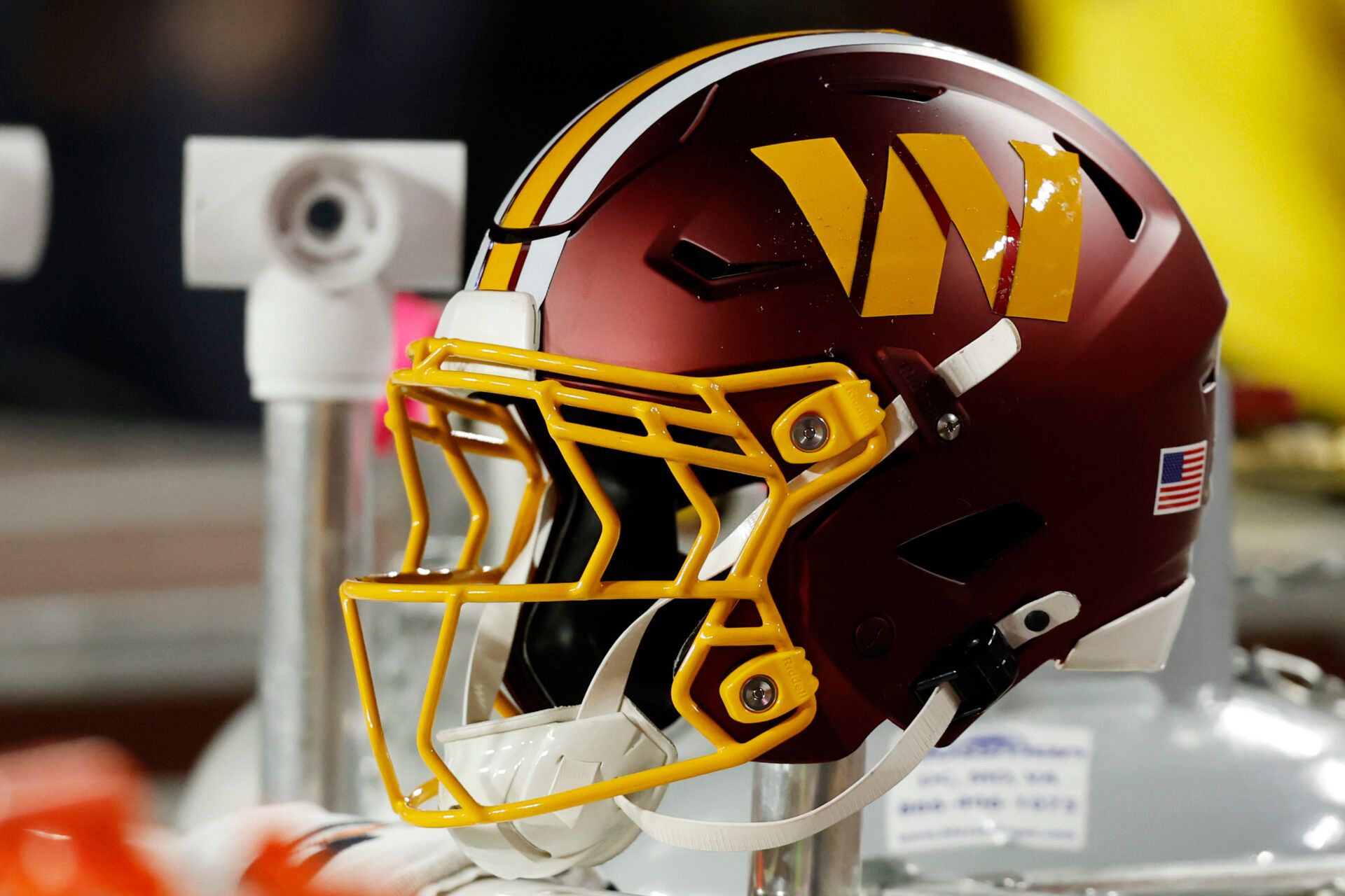 A Washington Commanders player's helmet on the bench during the game against the Seattle Seahawks at Northwest Stadium.