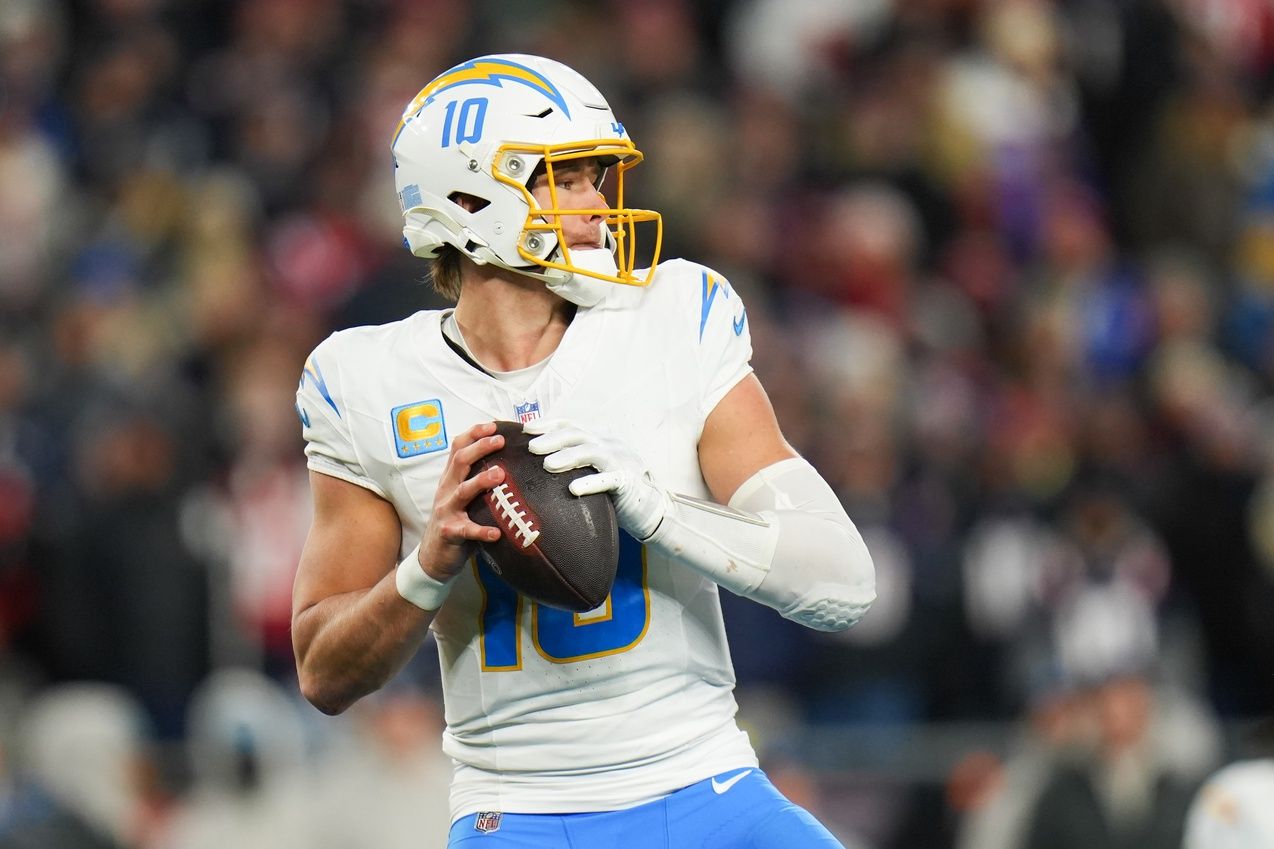 Los Angeles Chargers quarterback Justin Herbert (10) looks to pass during the third quarter against the New England Patriots in an AFC Wild Card Round game at Gillette Stadium.