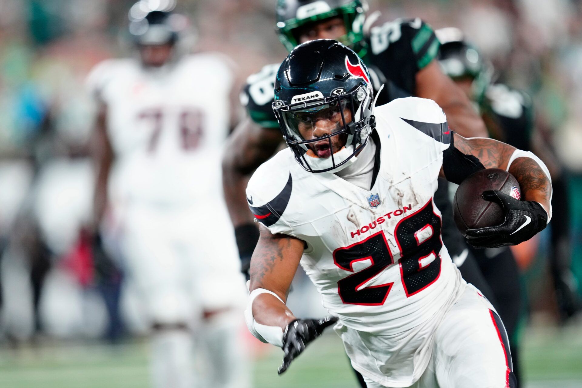 Houston Texans running back Joe Mixon (28) is shown with the ball during the first quarter, Thursday, October 31, 2024, in East Rutherford.
