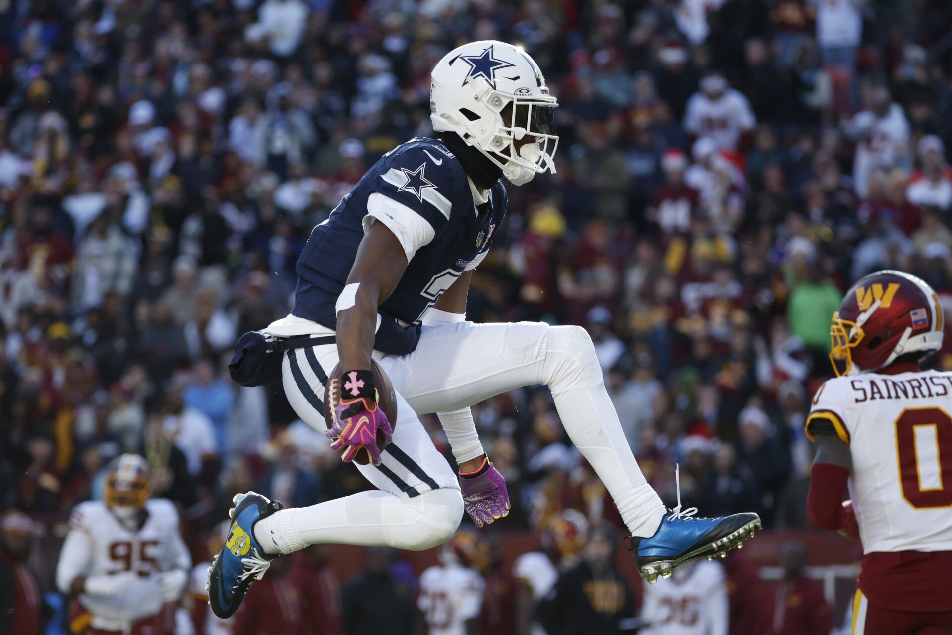 Dallas Cowboys wide receiver George Pickens (3) celebrates after a play against the Washington Commanders during the first half at Northwest Stadium.