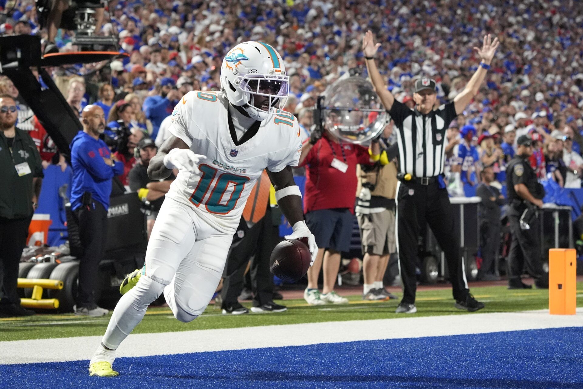 Miami Dolphins wide receiver Tyreek Hill (10) scores a touchdown against the Buffalo Bills in the fourth quarter at Highmark Stadium.