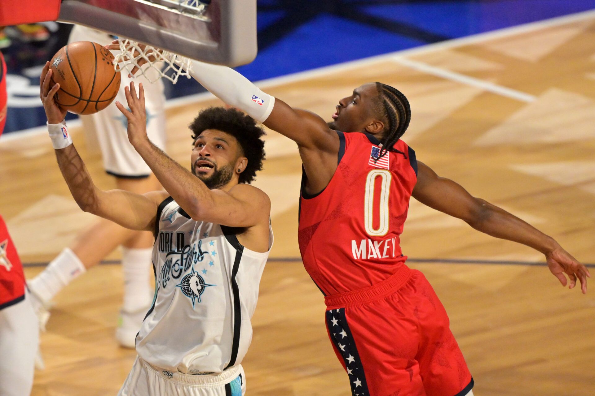 Team World guard Jamal Murray (27) of the Denver Nuggets shoots against Team USA Stars guard Tyrese Maxey (0) of the Philadelphia 76ers in game one during the 75th NBA All Star Game at Intuit Dome.