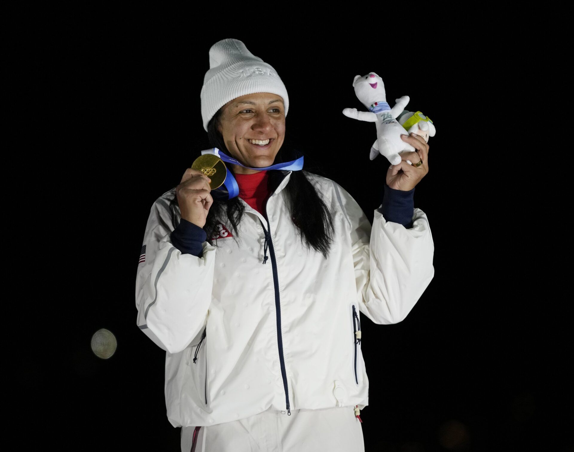 Elana Meyers Taylor of the United States celebrates with the gold medal after winning the women's bobsleigh monobob competition during the Milano Cortina 2026 Olympic Winter Games at Cortina Sliding Centre.