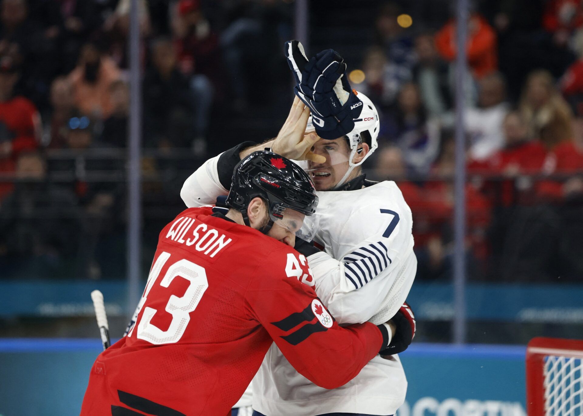 [US, Mexico & Canada customers only] Feb 15, 2026; Milan, Italy; Tom Wilson of Canada clashes with Pierre Crinon of France in men's ice hockey group A play during the Milano Cortina 2026 Olympic Winter Games at Milano Santagiulia Ice Hockey Arena.