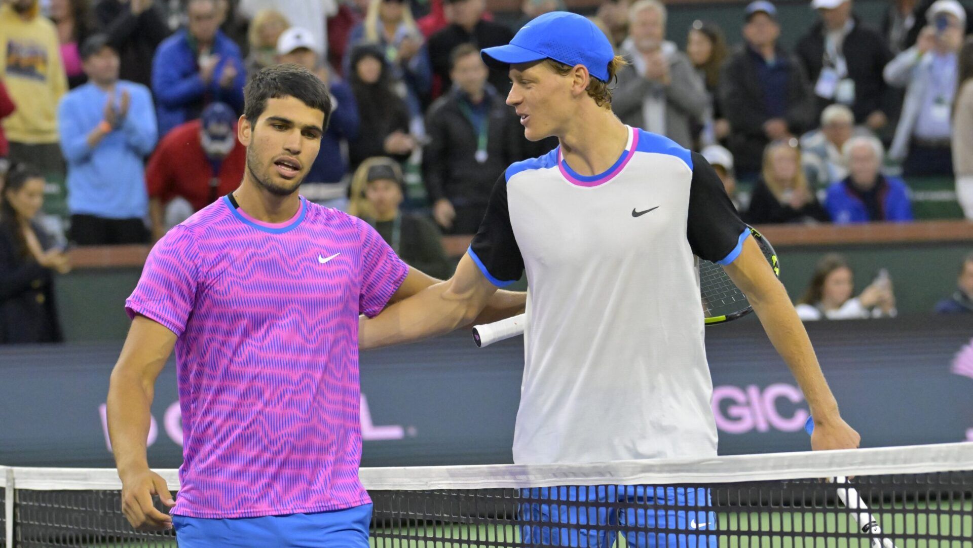 Carlos Alcaraz (ESP) is congratulated by Jannik Sinner (POL) after winning their semi-final match in the BNP Paribas Open at the Indian Wells Tennis Garden.