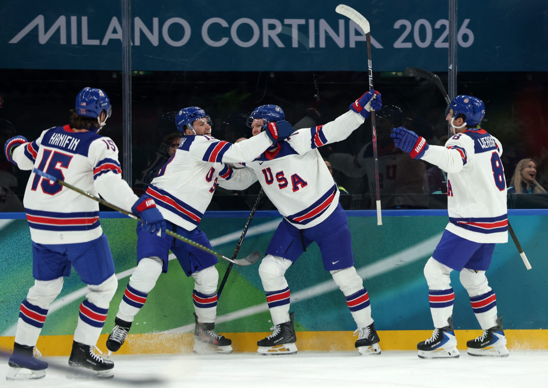 Brady Tkachuk of United States celebrates scoring their first goal with Matthew Tkachuk of United States and teammates against Latvia in men's ice hockey group C play during the Milano Cortina 2026 Olympic Winter Games at Milano Santagiulia Ice Hockey Arena.