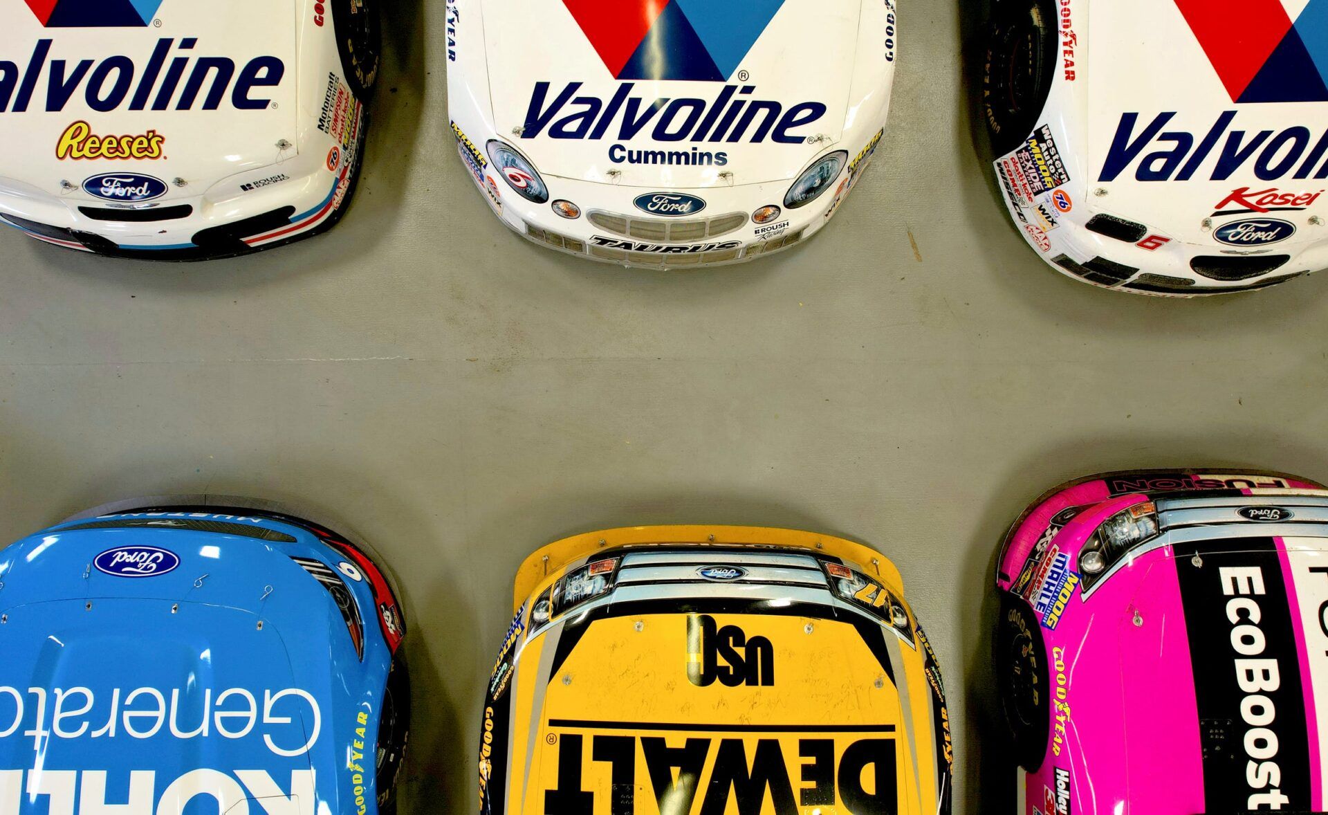 Some of the over 40 NASCAR cars and trucks in the Jack Roush collection inside the 30,000 square foot Roush Automotive Collection in Livonia on Wednesday, August 28, 2024.