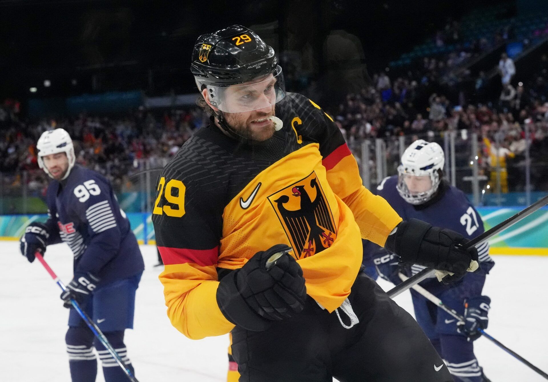Leon Draisaitl of Germany celebrates after scoring their first goal during a men's ice hockey qualification playoff game during the Milano Cortina 2026 Olympic Winter Games at Milano Santagiulia Ice Hockey Arena.