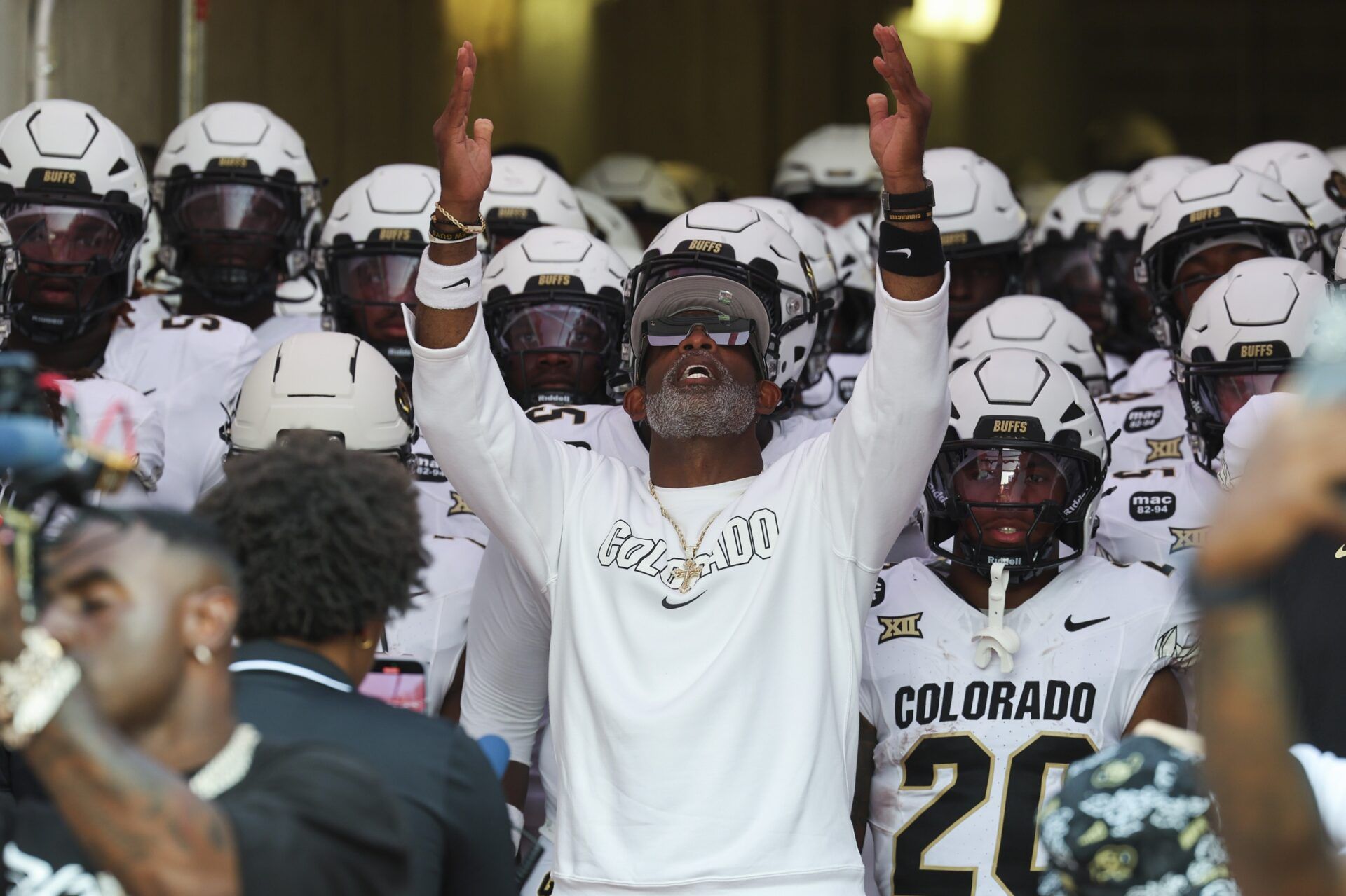 Colorado Buffaloes head coach Deion Sanders prepares to lead the team out of the tunnel before the game against the Houston Cougars at TDECU Stadium.