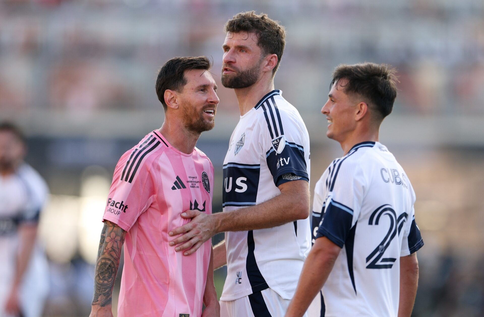 Inter Miami forward Lionel Messi (10) speaks with Vancouver Whitecaps FC forward Thomas Muller (13) and midfielder Andres Cubas (20) in the second half during the 2025 MLS Cup at Chase Stadium.
