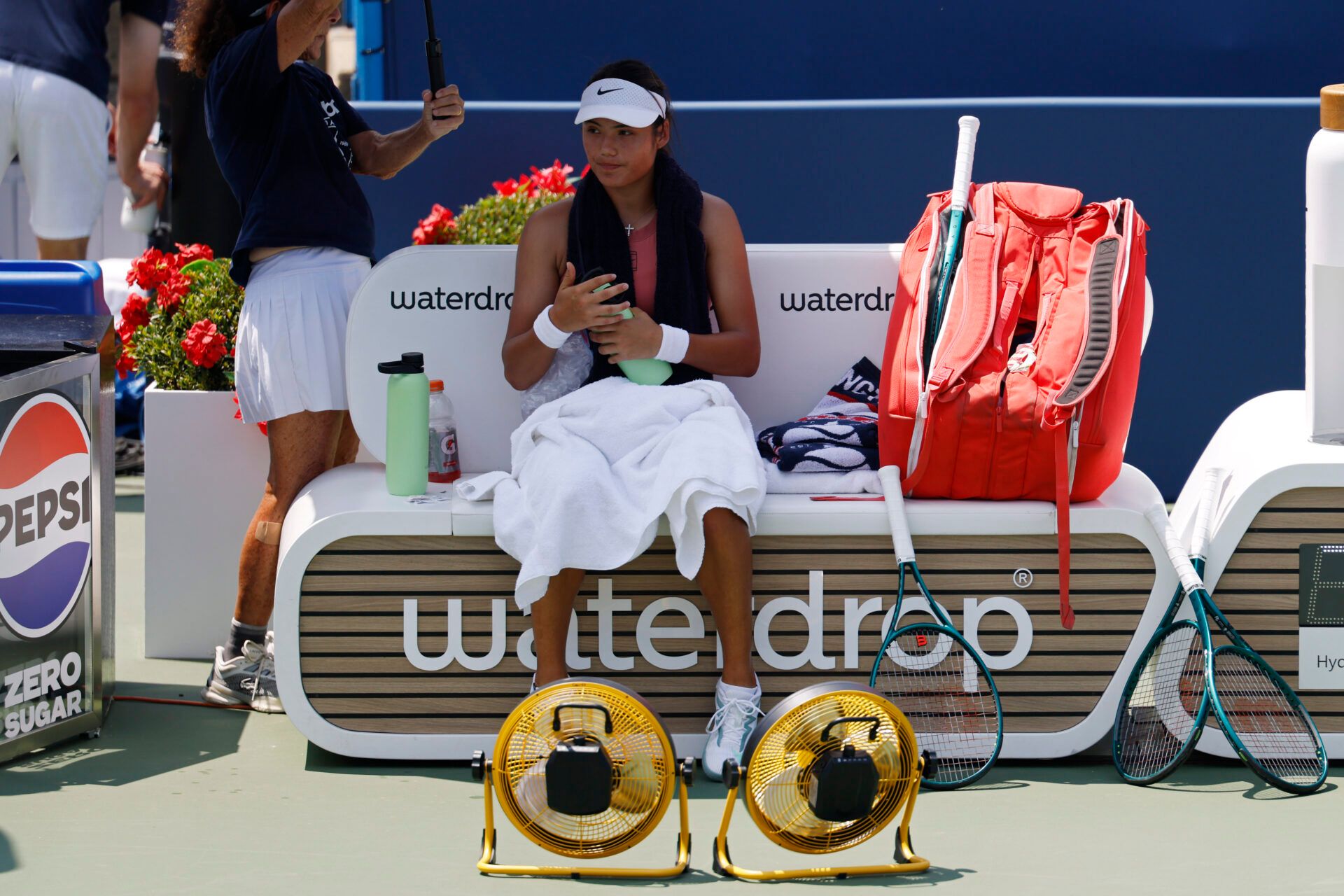 Emma Raducanu (GBR) sits in her player's chair during a changeover against Maria Sakkari (GRE)(not pictured) in a women's singles quarter-final of the Mubadala Citi DC Open at Rock Creek Park Tennis Center.