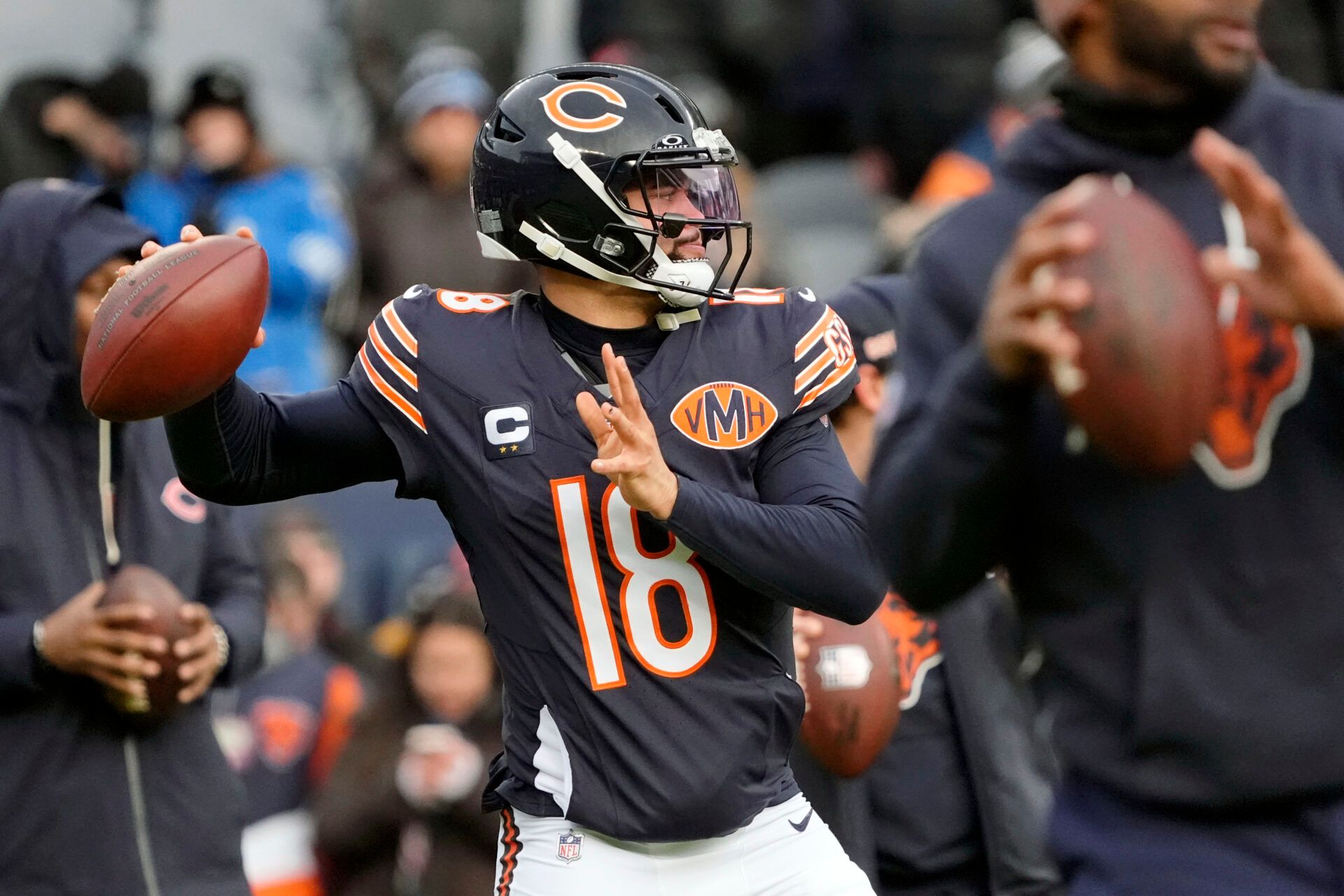 Chicago Bears quarterback Caleb Williams (18) warms up before the game between the Chicago Bears and the Detroit Lions at Soldier Field.
