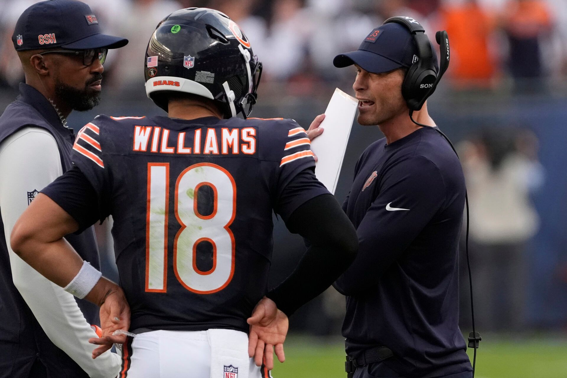 Chicago Bears head coach Ben Johnson talks with quarterback Caleb Williams (18) against the Dallas Cowboys during the second half at Soldier Field.
