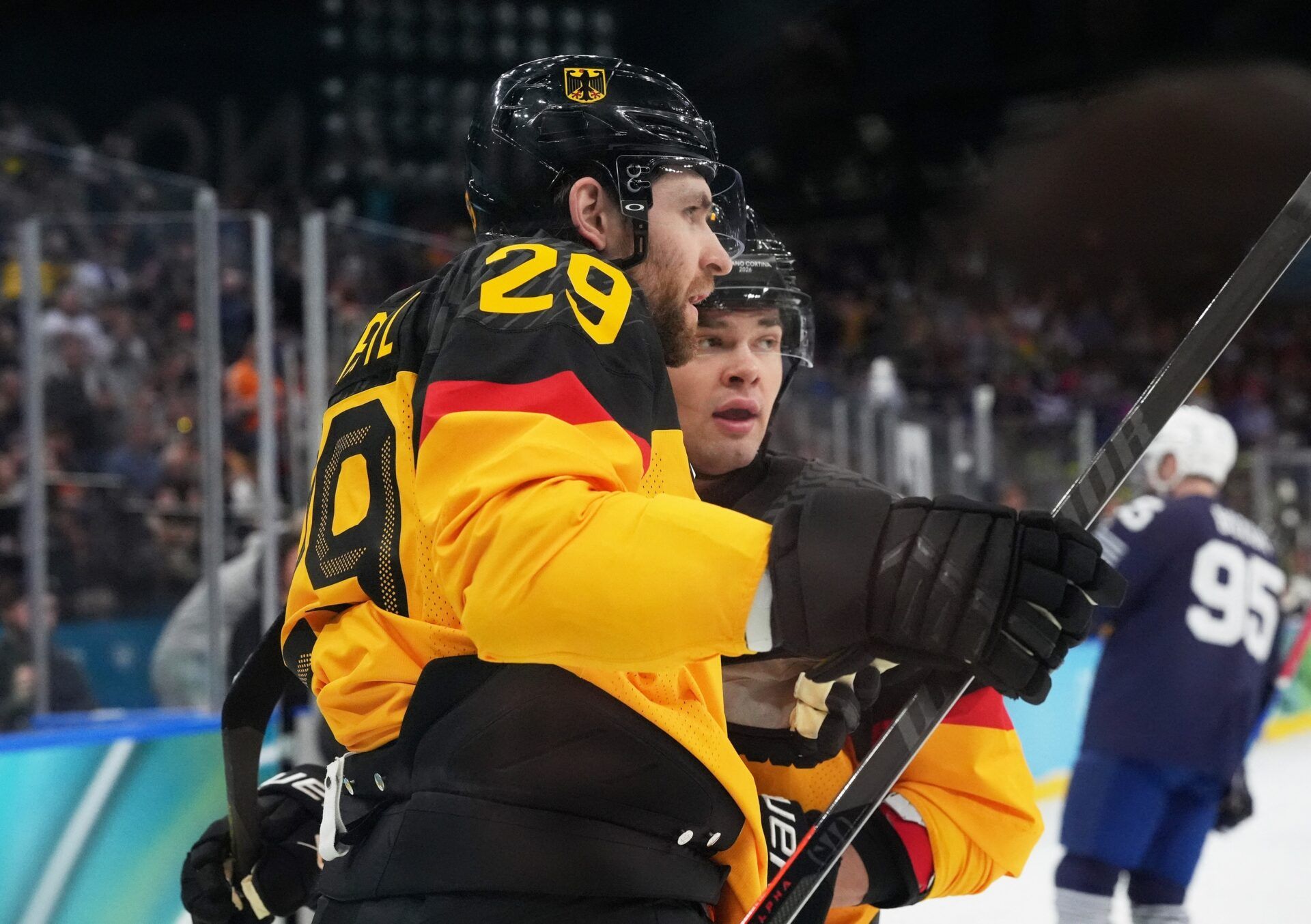 Leon Draisaitl of Germany celebrates after scoring their first goal during a men's ice hockey qualification playoff game during the Milano Cortina 2026 Olympic Winter Games at Milano Santagiulia Ice Hockey Arena.