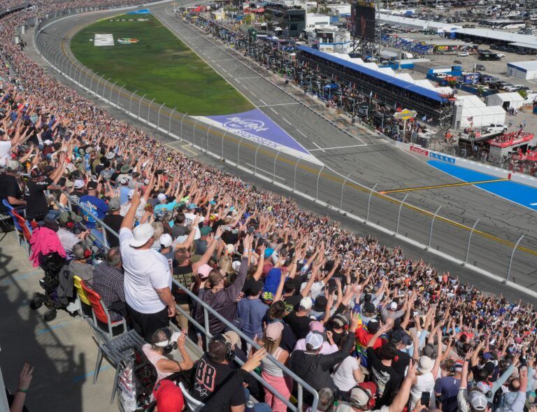 NASCAR fans hold up three fingers on Lap 3 of the Daytona 500 to honor Dale Earnhardt, Sunday, Feb. 15, 2026 at Daytona International Speedway.