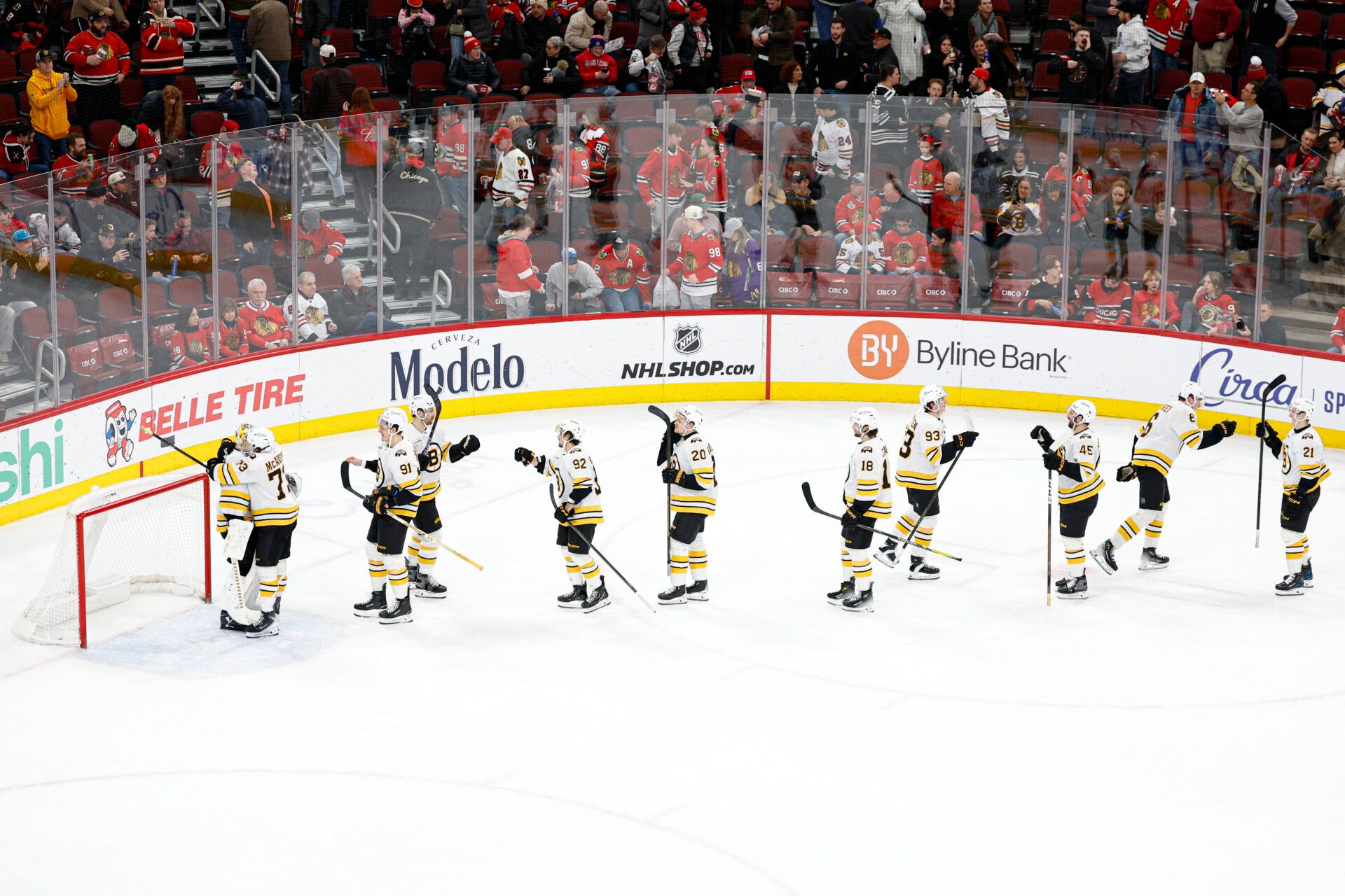 Boston Bruins players celebrate at United Center.