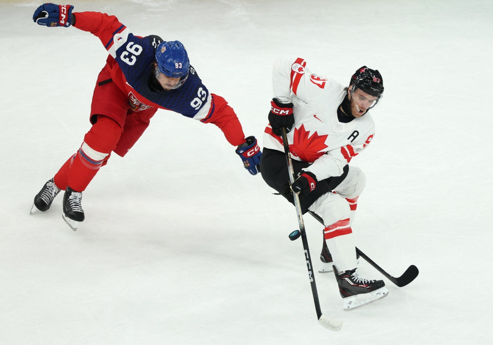[US, Mexico & Canada customers only] Feb 12, 2026; Milan, Italy; Connor McDavid of Canada in action with Matej Stransky of Czechia  in a men's ice hockey Group A match during the Milano Cortina 2026 Olympic Winter Games at Milano Santagiulia Ice Hockey Arena.