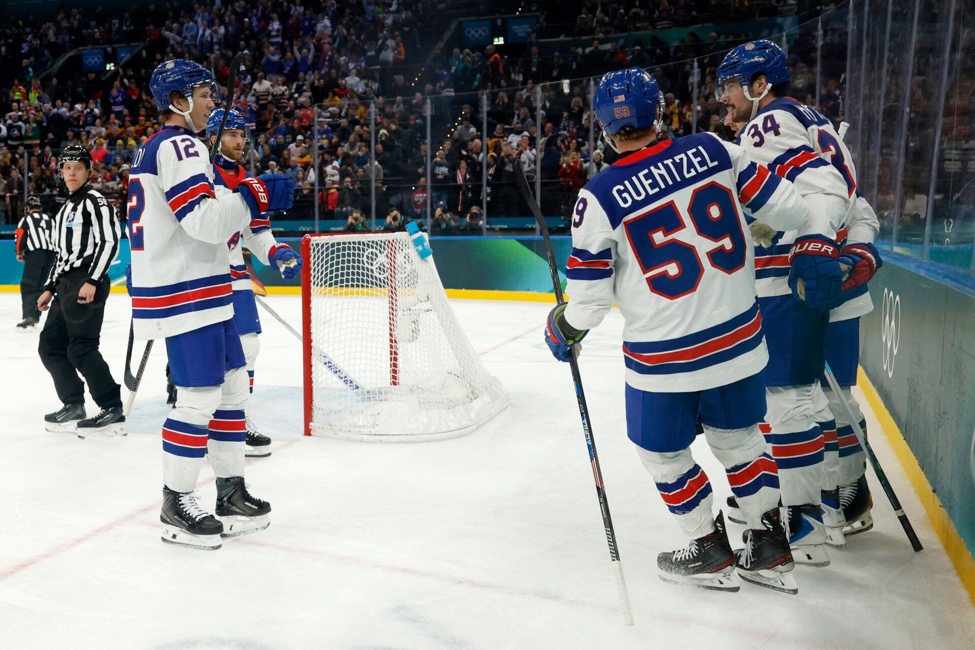 Auston Matthews of United States celebrates scoring their fifth goal with teammates  against Germany in men's ice hockey group C play during the Milano Cortina 2026 Olympic Winter Games at Milano Santagiulia Ice Hockey Arena.