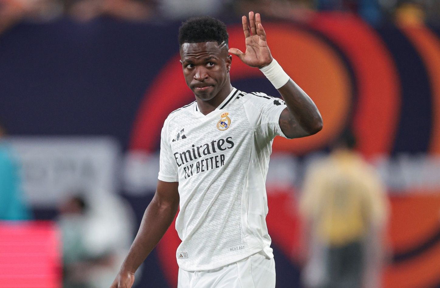 Real Madrid forward Vinicius Junior (7) gestures to fans during the second half of an international friendly against Barcelona at MetLife Stadium.