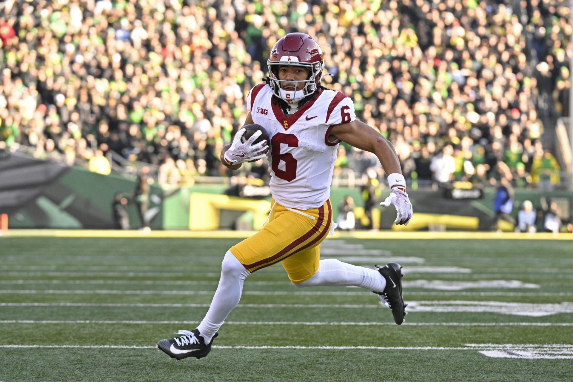 Southern California Trojans wide receiver Makai Lemon (6) runs with the ball during the first half against the Oregon Ducks at Autzen Stadium.