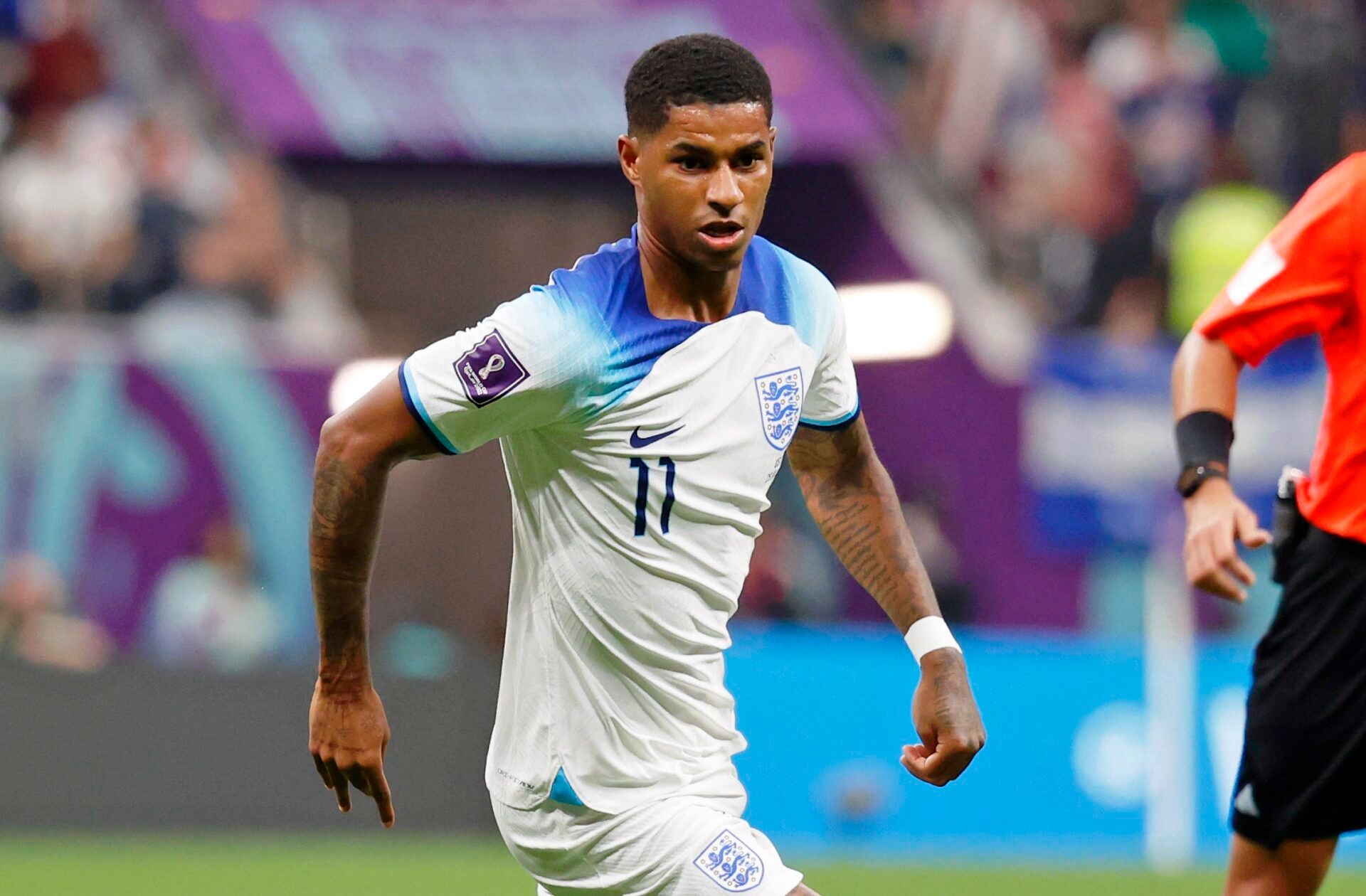 England forward Marcus Rashford (11) dribbles the ball against the United States of America during the second half of a group stage match during the 2022 World Cup at Al Bayt Stadium.