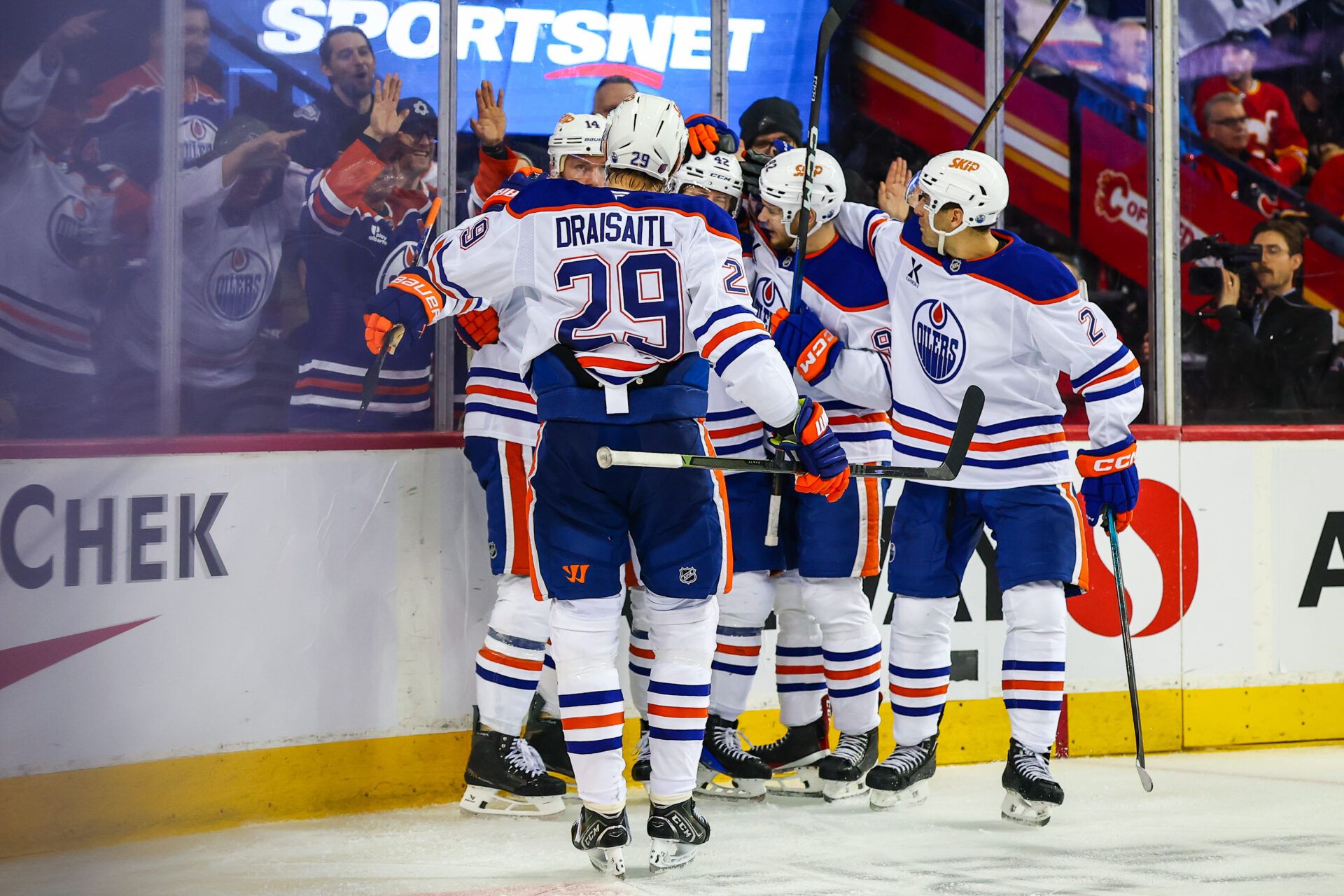 Edmonton Oilers right wing Kasperi Kapanen (42) celebrates his goal with teammates against the Calgary Flames during the third period at Scotiabank Saddledome.