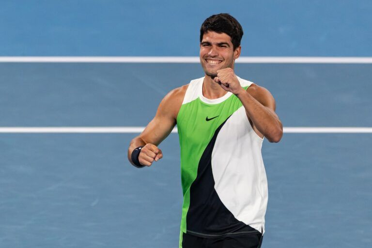 Carlos Alcaraz of Spain celebrates his victory over Novak Djokovic of Serbia in the final of the mens singles at the Australian Open at Rod Laver Arena in Melbourne Park.