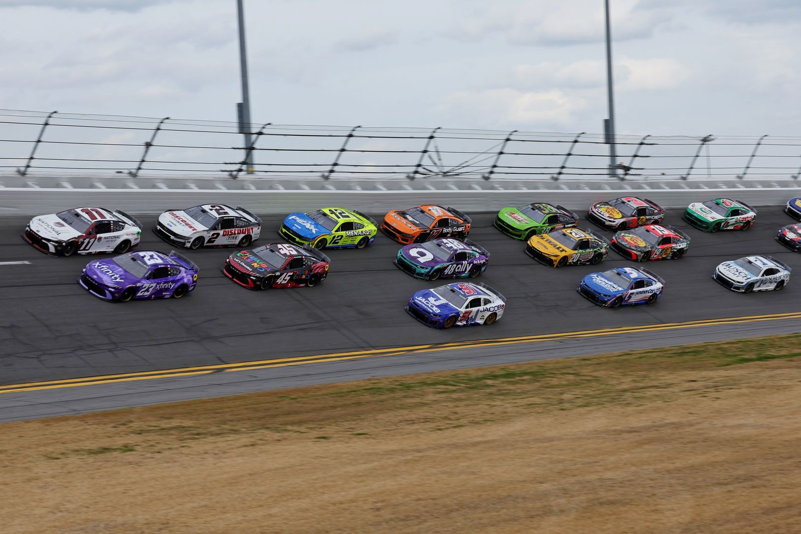 The leader cars round the track during the 68th running of the Daytona 500 at Daytona International Speedway.